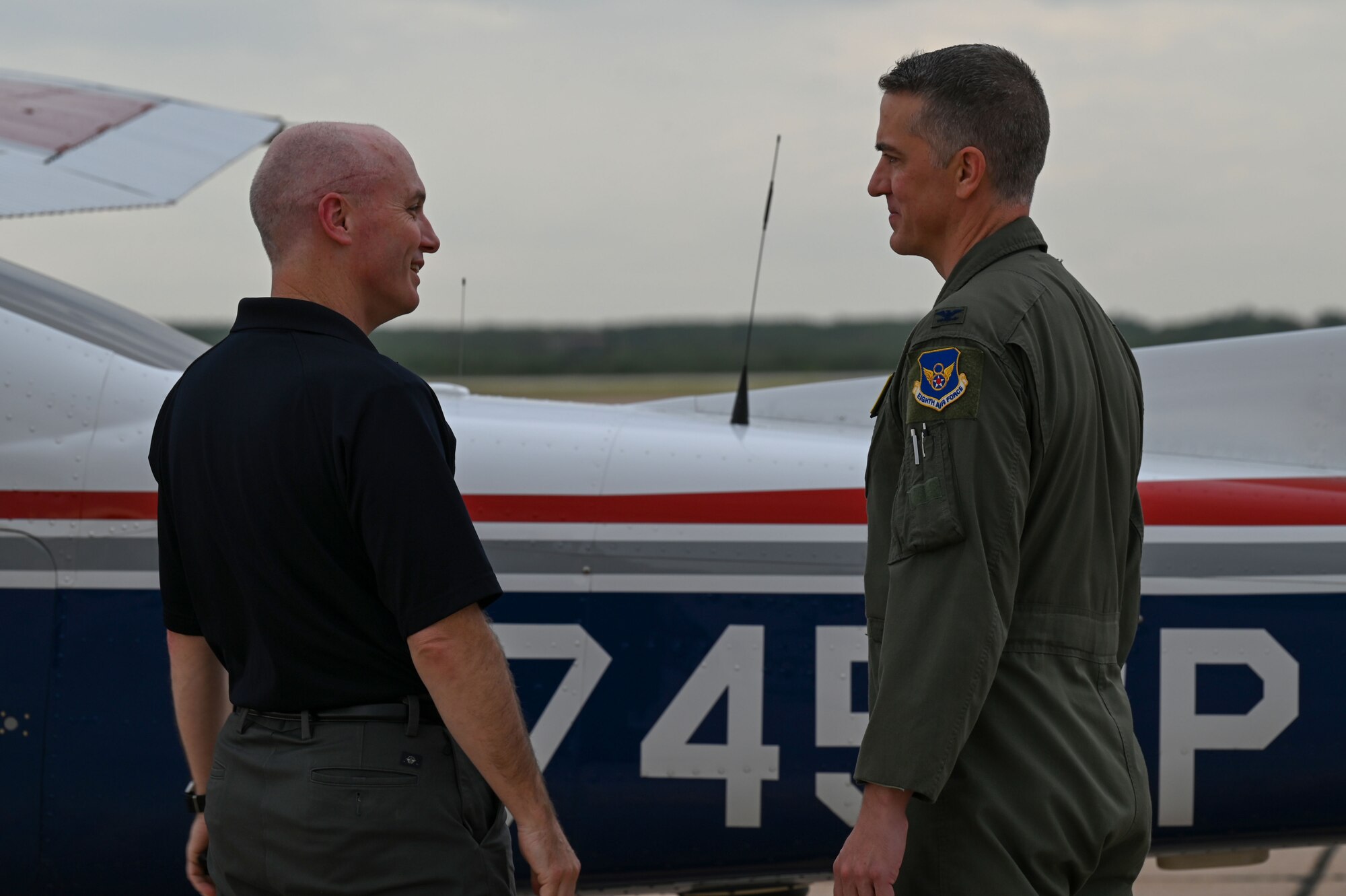 Col. Aaron Oliver, Oklahoma Wing Civil Air Patrol commander, talks with Col. Samuel Friend, 7th Bomb Wing deputy commander, after landing at Dyess Air Force Base, Texas, Sept. 21, 2023. The CAP is the civilian auxiliary of the U.S. Air Force, dedicated to providing support in emergency services, aerospace and cadet programs. (U.S. Air Force photo by Senior Airman Sophia Robello)