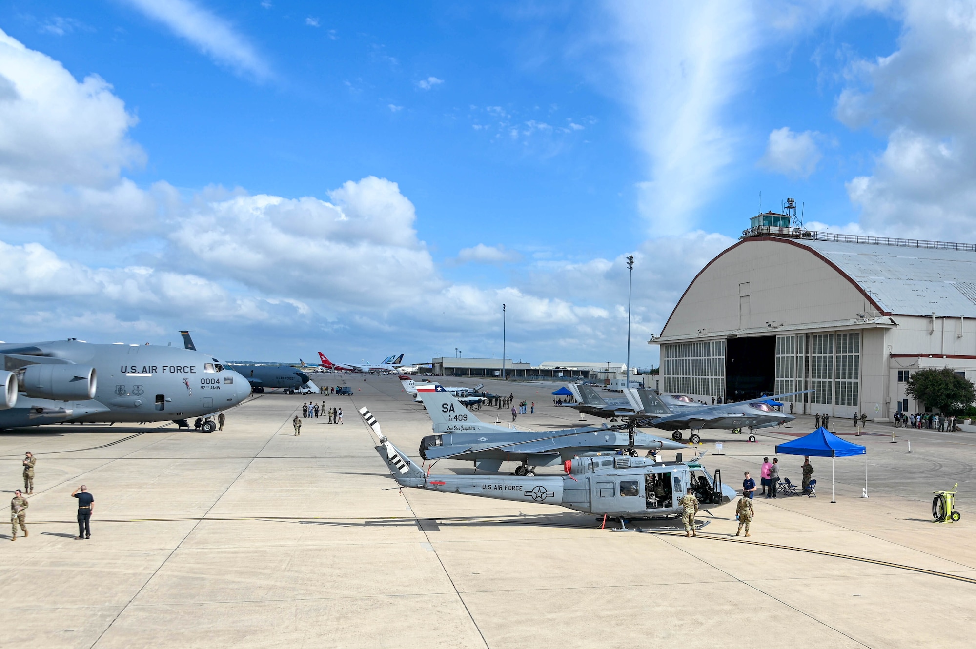 Airmen, Guardians, and community members view different aircraft at the Torch Athena Fly-In in San Antonio, Texas, on Sept. 21, 2023. The women’s fly-in aimed to educate, inspire and influence the next generation of aviators. (U.S. Air Force photo by Airman 1st Class Heidi Bucins)
