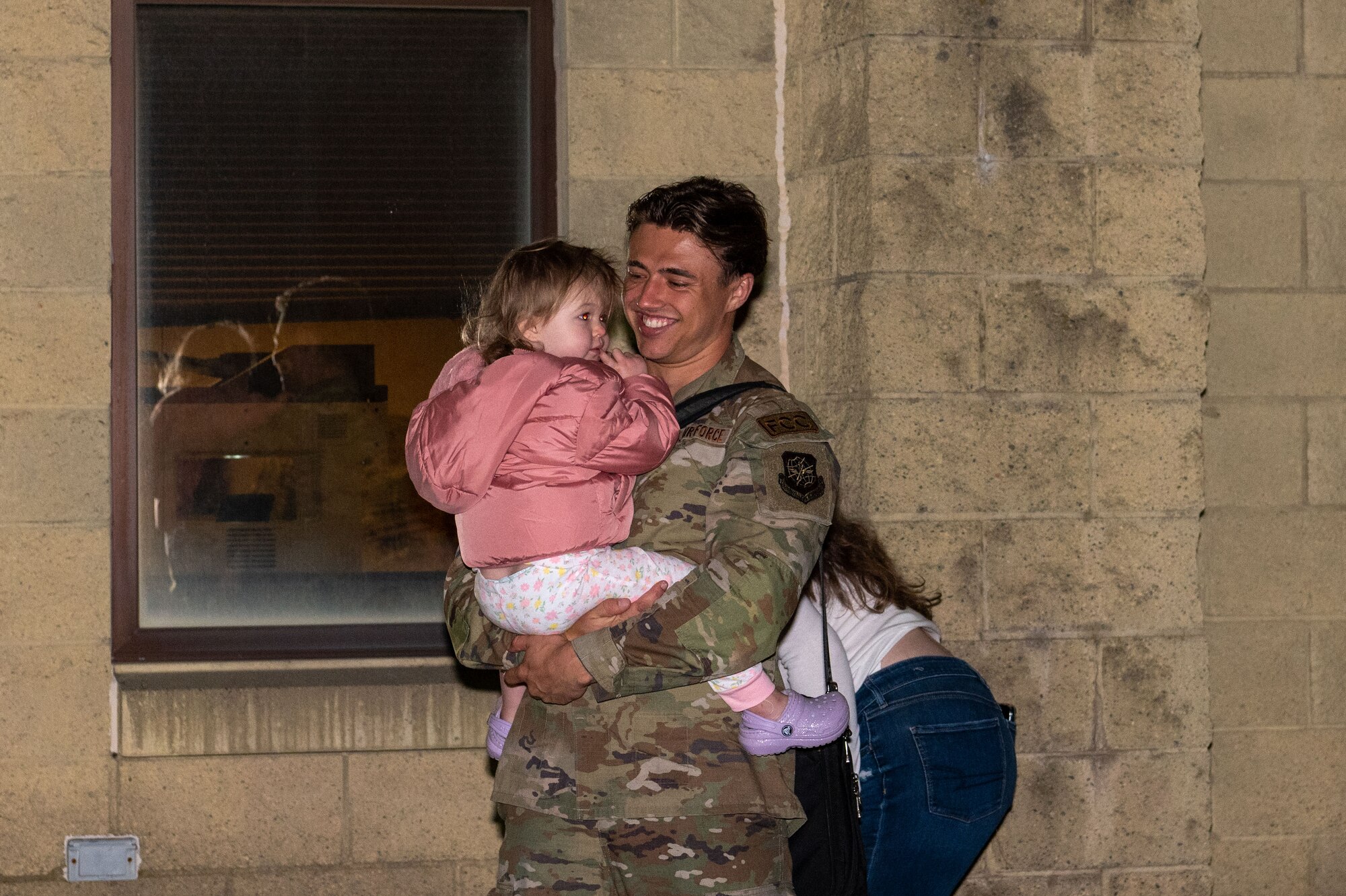 U.S. Air Force Staff Sgt. Brandon Weiss, a flying crew chief assigned to the 92nd Aircraft Maintenance Squadron, and his family reunite at Fairchild Air Force Base, Washington, Sept. 2, 2023, upon his return from deployment. The 92nd AMXS and the 93rd Air Refueling Squadron deployed over 150 personnel for roughly six months to support a variety of missions in the European theater. The 92nd Air Refueling Wing projects extends global reach and deterrence through empowered Airmen who perform aerial refueling, aero-medical evacuations, and passenger and cargo transport. (U.S. Air Force photo by Airman 1st Class Stassney Davis)