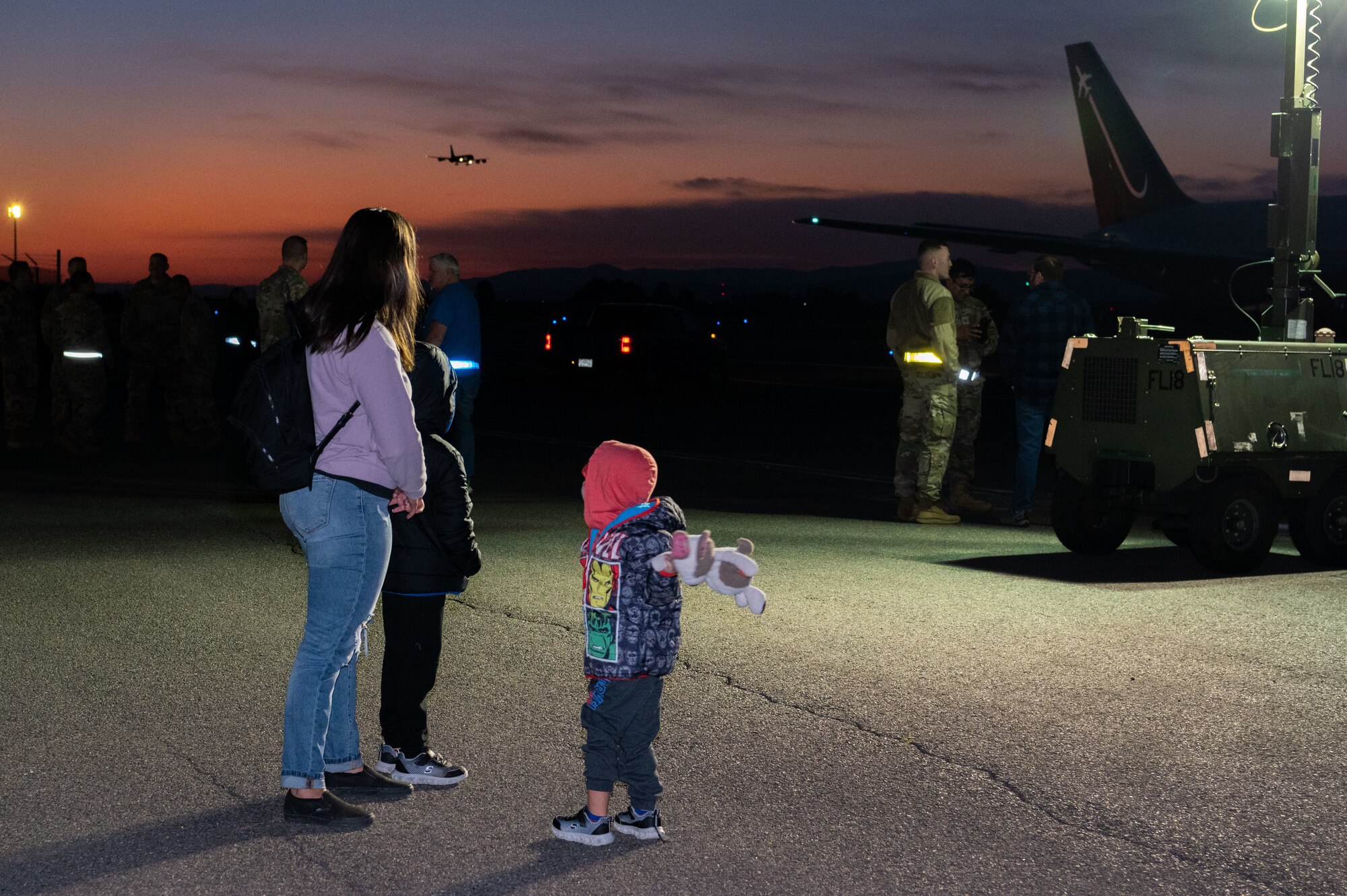 Tech Sgt. Paje Keepers, an Airman Leadership School instructor assigned to the 92nd Force Support Squadron, and her family watch a KC-135 Stratotanker land while waiting for her spouse to return from deployment, at Fairchild Air Force Base, Washington, Sept. 2, 2023. The 93rd Air Refueling Squadron and the 92nd Aircraft Maintenance Squadron deployed over 150 personnel for roughly six months to support a variety of missions in the European theater. The 92nd Air Refueling Wing projects extends global reach and deterrence through empowered Airmen who perform aerial refueling, aero-medical evacuations, and passenger and cargo transport. (U.S. Air Force photo by Airman 1st Class Stassney Davis)