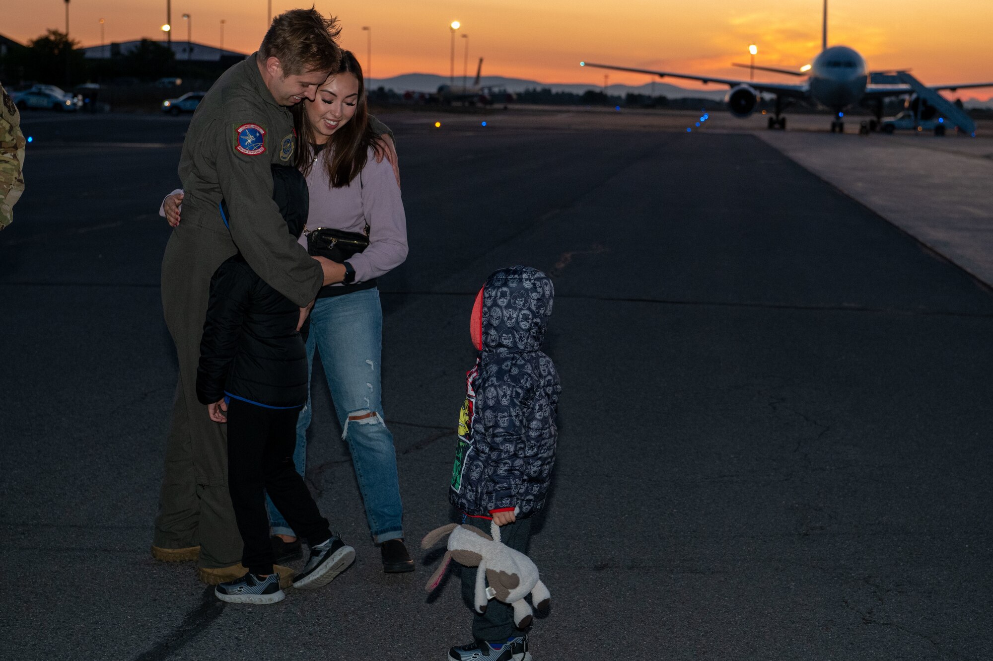 Tech Sgt. Andrew Keepers, a KC-135 Stratotanker in-flight refueling specialist assigned to the 93rd Air Refueling Squadron, and his family reunite after his return from deployment at Fairchild Air Force Base, Washington, Sept. 2, 2023. The 93rd ARS and the 92nd Aircraft Maintenance Squadron deployed over 150 personnel for roughly six months to support a variety of missions in the European theater. The 92nd Air Refueling Wing projects extends global reach and deterrence through empowered Airmen who perform aerial refueling, aero-medical evacuations, and passenger and cargo transport. (U.S. Air Force photo by Airman 1st Class Stassney Davis)