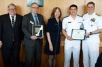 ANNAPOLIS, Md. (Sept. 21, 2023) Rear Adm. Fred Kacher, left, acting superintendent of the U.S. Naval Academy; retired Rear. Adm. Sam Cox, director of Naval History and Heritage Command; Dr. Jennifer London, chair of the Navy League Foundation Board of Directors; and retired Vice Adm. Peter H. Daly, CEO of the U.S. Naval Institute, present awards to Midshipman 1st Class Liam Narawa for his first prize essay in the Midshipman and Cadets category titled, 