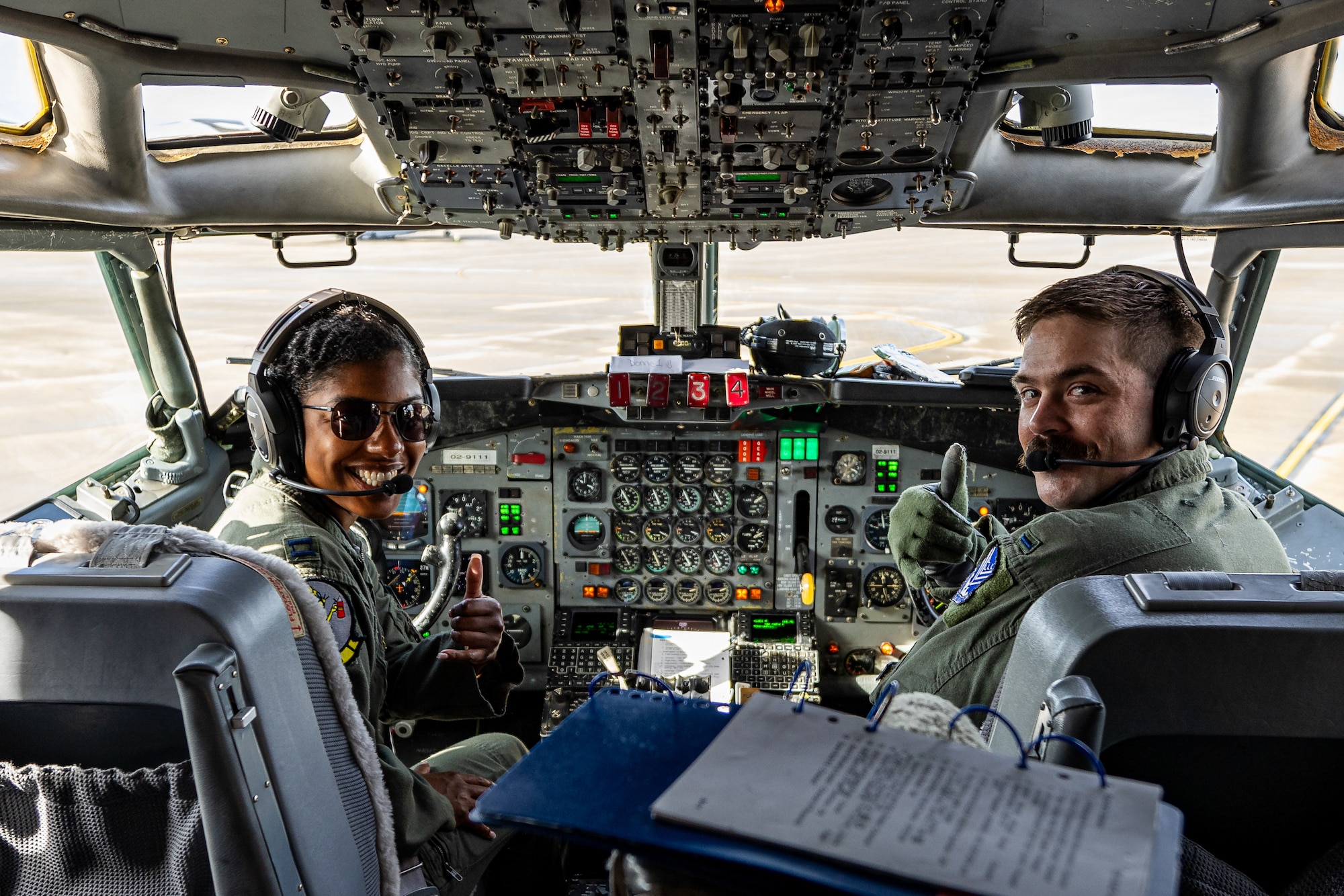U.S. Air Force Capt. Andrea Coleman and 2nd Lt. Travis Trent, pilots with the 116th Air Control Wing, Georgia Air National Guard, give the thumbs up on an E-8C Joint STARS during its last mission at Ramstein Air Force Base,  Germany, Sept. 21, 2023.