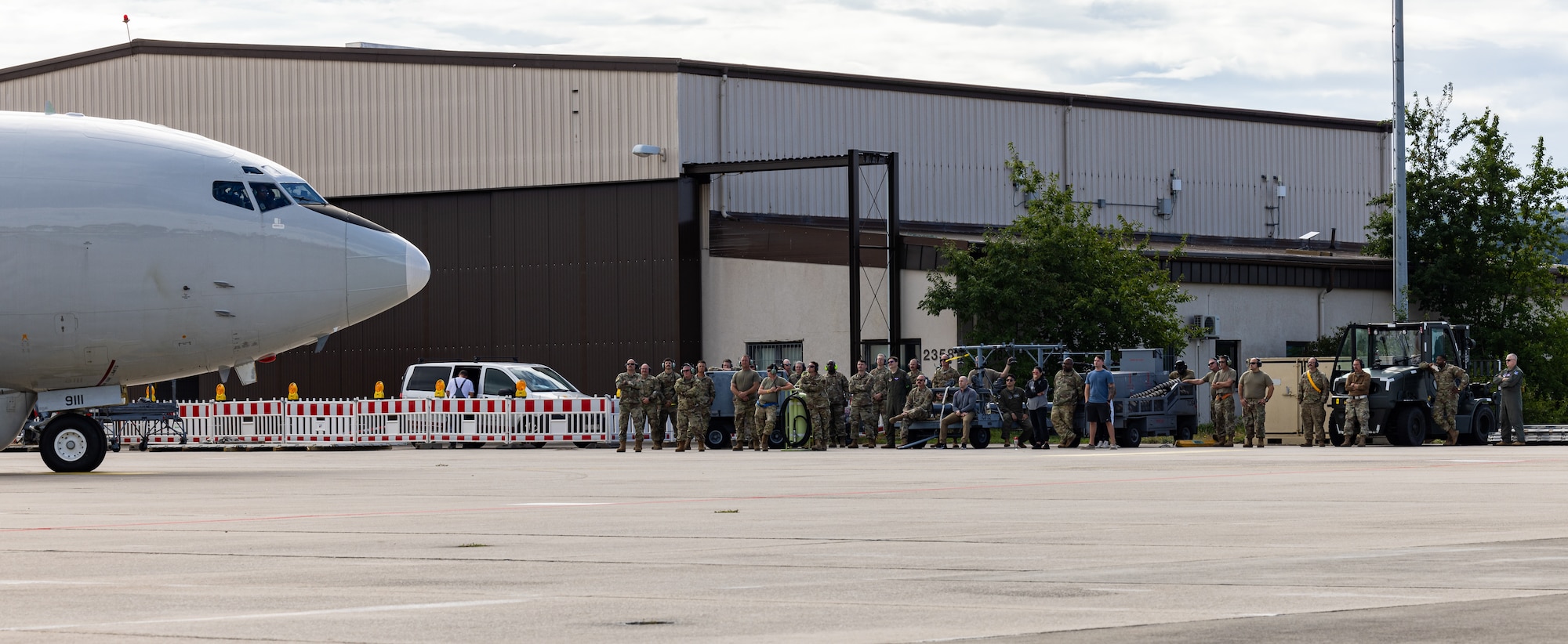 U.S. Airmen with the 116th Air Control Wing, Georgia Air National Guard, watch an E-8C Joint STARS taxi for its last mission at Ramstein Air Force Base,  Germany, Sept. 21, 2023.