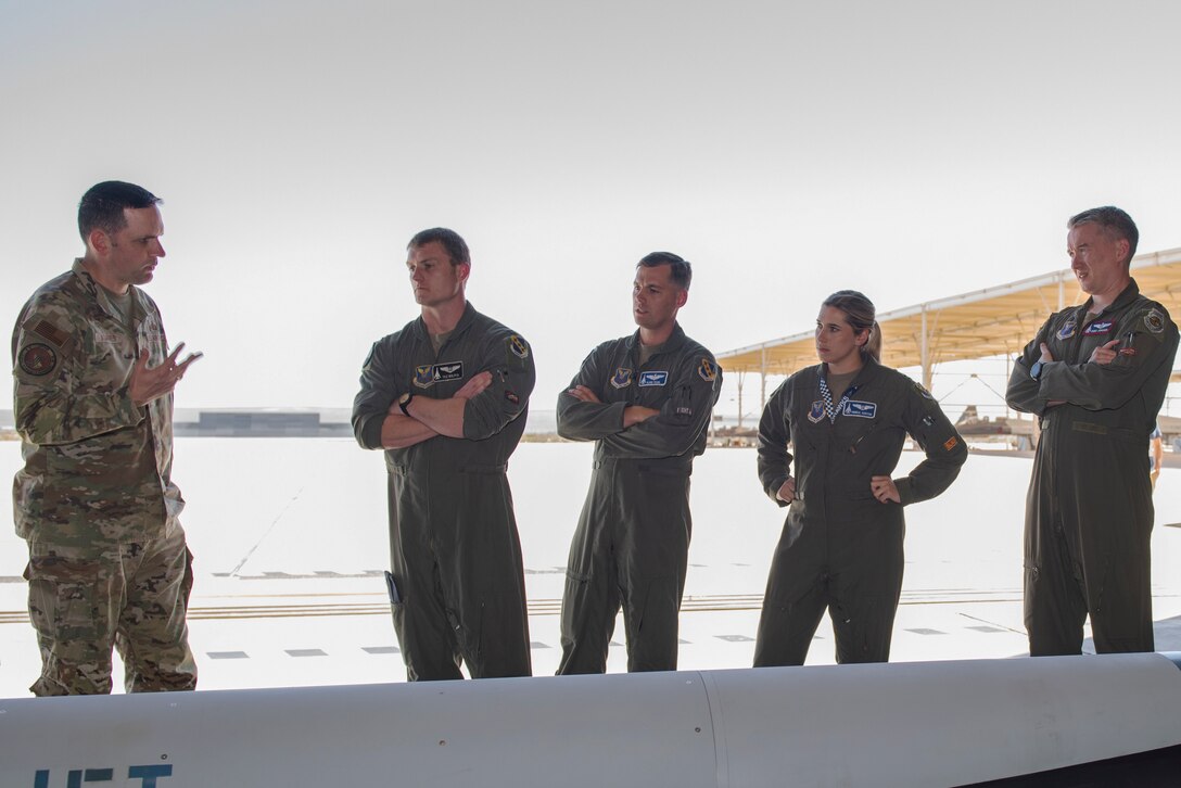 U.S. Air Force Lt. Col. Jeffrey Komives, Hypersonic Employment subject matter expert, orients operational crews B-1 Lancer, B-2 Spirit, B-52 Stratofortress, and F-15E Strike Eagle units across Air Force Global Strike Command and Air Combat Command on the Air Force’s Hypersonic Attack Cruise Missile as they participate in hypersonic weapon familiarization training at Edwards Air Force Base, California, Sept. 28, 2023. The participating crews received expert academics and training on hypersonic fundamentals and participated in tactical discussion on hypersonic operations to increase operational readiness and prepare multiple aircraft communities for hypersonics including the Hypersonic Attack Cruise Missile, Air-launched Rapid Response Weapon, and other programs under development. The Department of Defense is developing hypersonic science and technology to ensure the U.S. can rapidly field operational hypersonic systems. (U.S. Air Force photo by Lindsey Iniguez