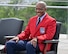 Air Force Chief of Staff Gen. CQ Brown, Jr. listens to remarks during a ceremony at the Air Force Memorial, Arlington, Va., Aug. 14, 2021. Brown was presented a red jacket, making him an honorary Tuskegee Airman. (U.S. Air Force photo by Eric Dietrich)