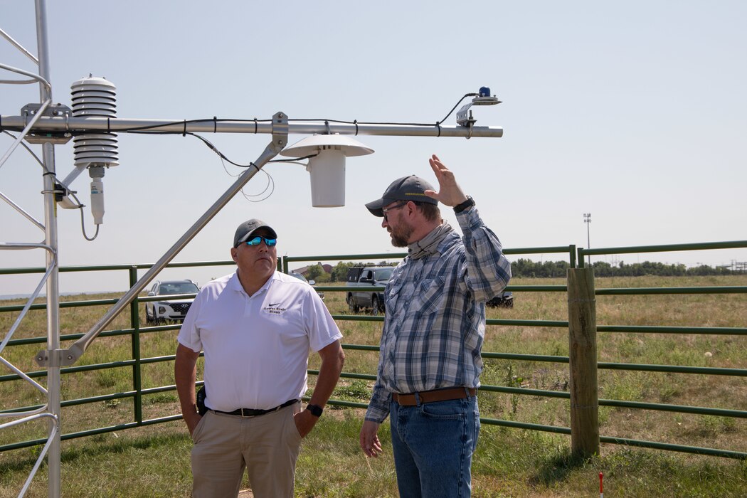 Sioux Tribal Chairman Clyde Estes (Left) and SDSU Manager Nathan Edwards (right) on a site visit to the recently completed mesonet weather station on the Lower Brule Sioux Reservation, Aug. 23, 2023.