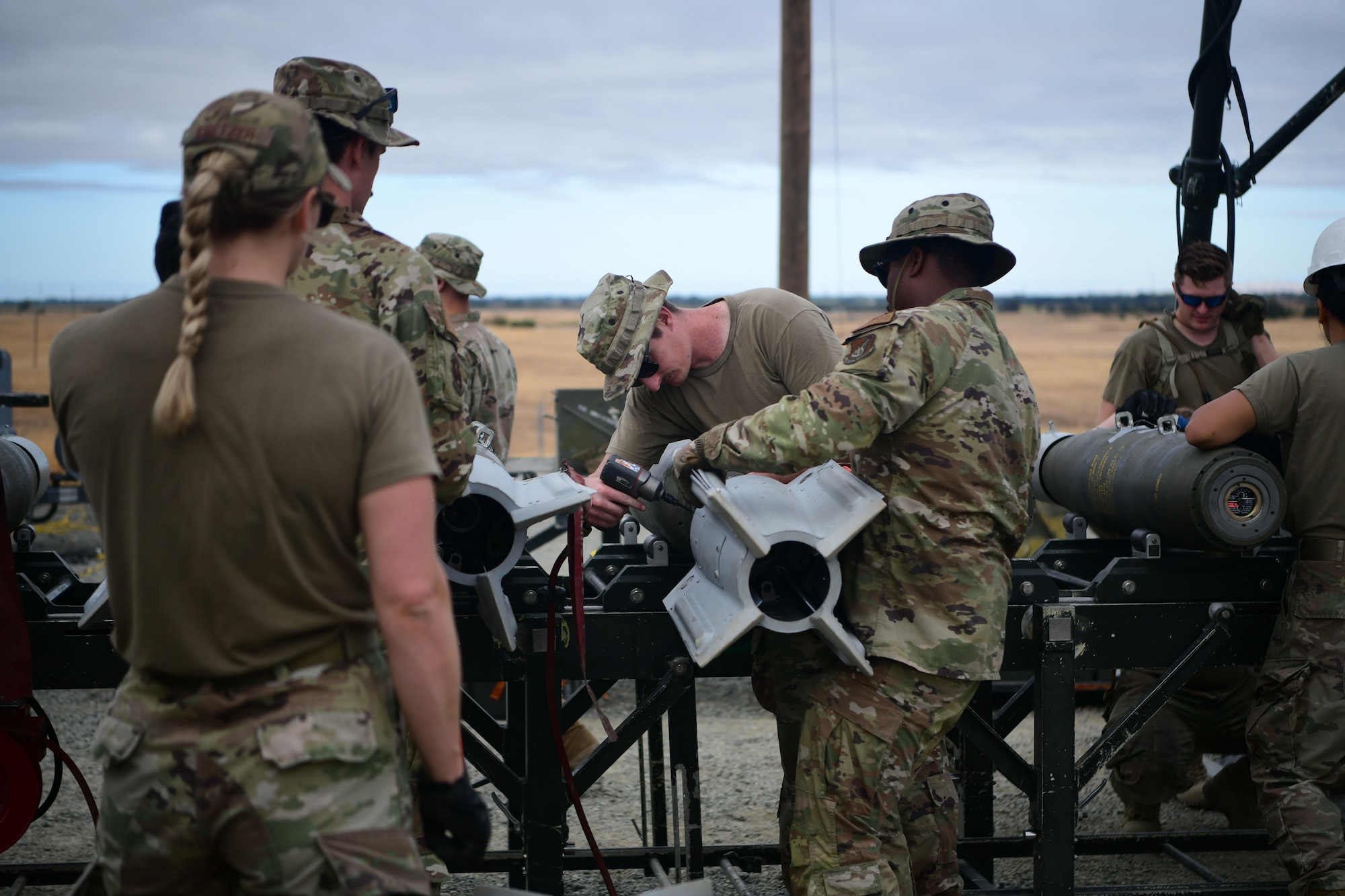 A group of 9th Munitions Squadron Airmen construct bombs during the senior officer orientation (SOO) course on Beale Air Force Base, California on Sept. 25, 2023.