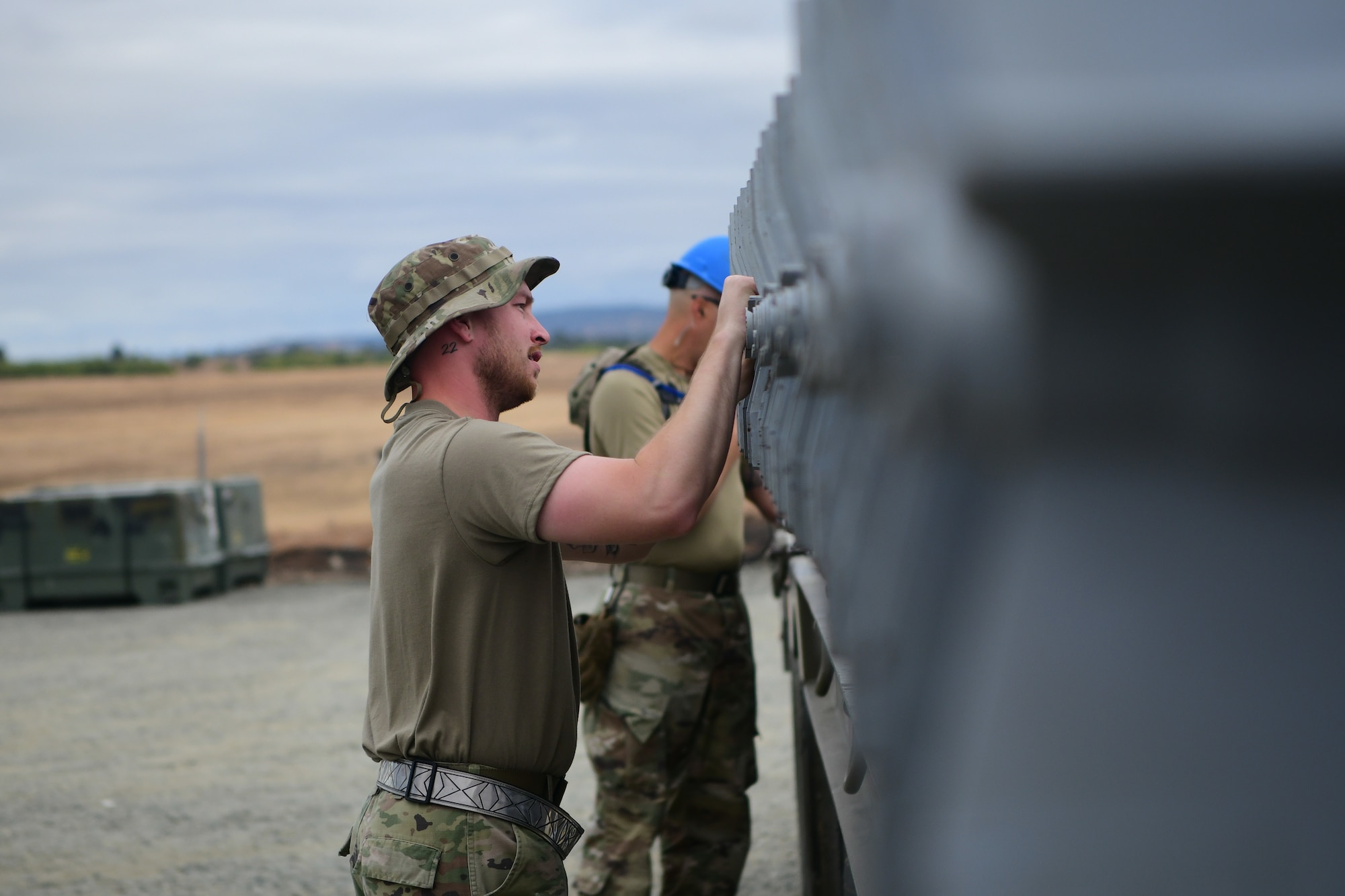 A 9th Munitions Squadron Airman inspects munitions loaded on a truck bed on Beale Air Force Base, California on Sept. 25, 2023.