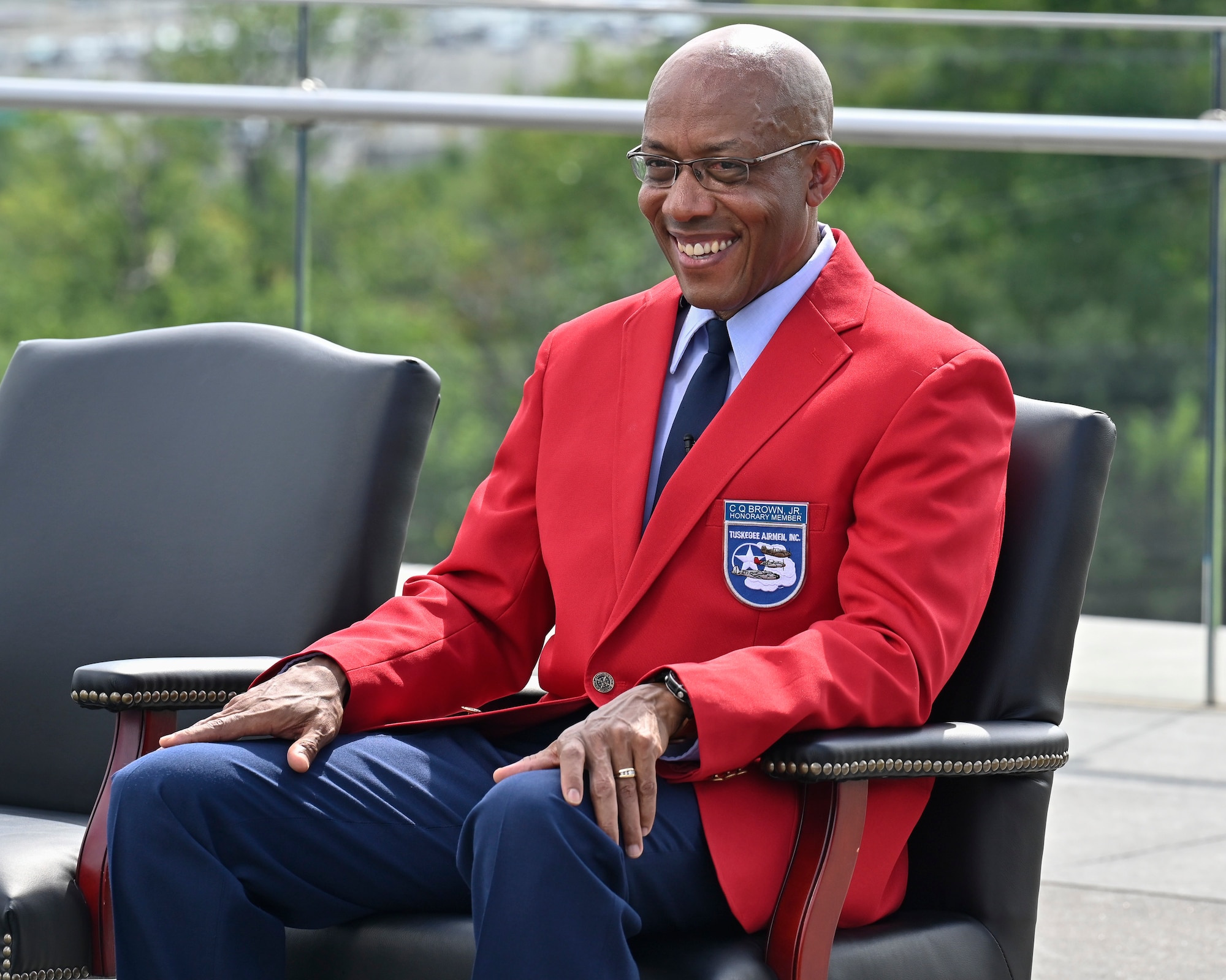 Air Force Chief of Staff Gen. CQ Brown, Jr. listens to remarks during a ceremony at the Air Force Memorial, Arlington, Va., Aug. 14, 2021. Brown was presented a red jacket, making him an honorary Tuskegee Airman. (U.S. Air Force photo by Eric Dietrich)