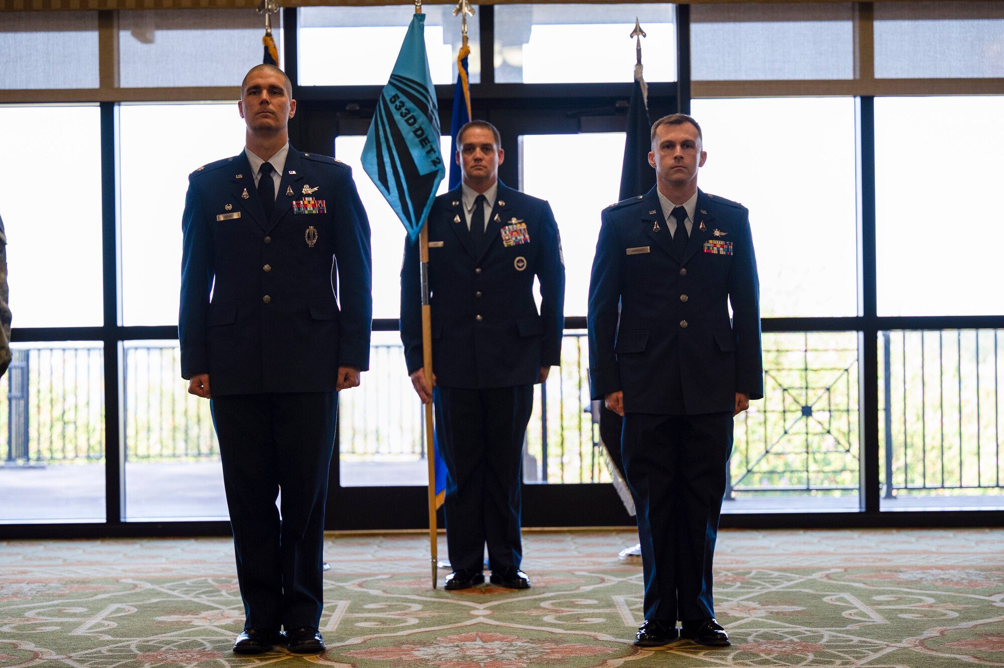 U.S. Space Force Lt. Col. Jonathan R. Arehart, 533rd Training Squadron commander, and Capt. Samuel Aspiranti III, incoming Detachment 2 commander, stand at attention during the 533rd TRS Det 2 activation and Assumption of Command ceremony at Keesler Air Force Base, Mississippi, Sept. 19, 2023.