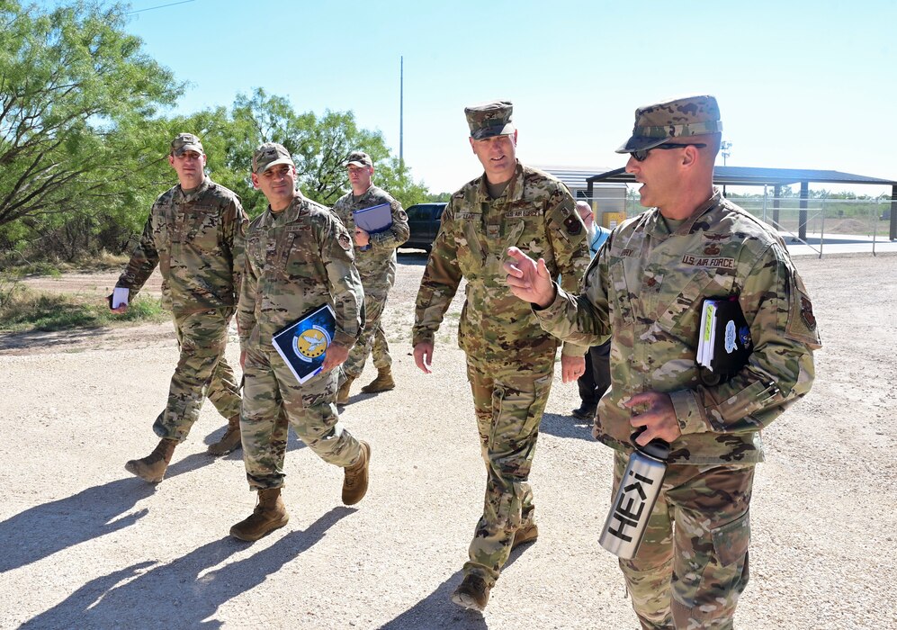 U.S. Air Force Maj. Christopher Perry, 313th Training Squadron director of operations, briefs Col. Matthew Leard, Air Education Training Command Chief of Staff, and Col. Nicholas Dipoma, 2nd Air Force deputy commander, on the future of Joint All Domain Exercise, Forward Operation Readiness Generation Exercise at Goodfellow Air Force Base, Texas, Sept. 28, 2023. JADE FORGE is a simulated austere environment where students from each branch will work together to increase interoperability among all Department of Defense services. (U.S. Air Force photo by Airman 1st Class Madison Collier)