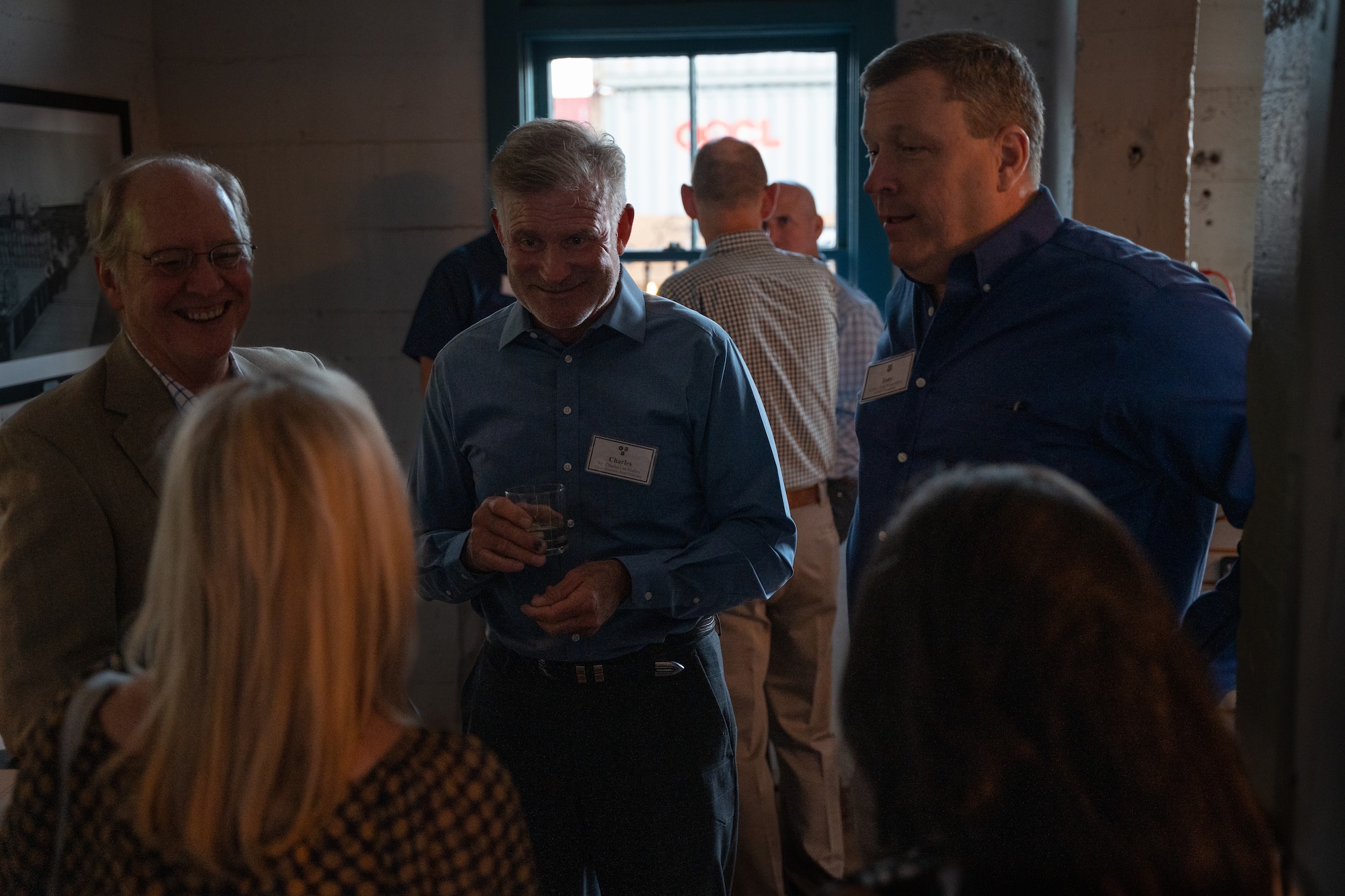 Charles Lee Malloy, Clovis economic Board President, and Air Force Special Operations Command commander Lt. Gen. Tony Bauernfeind talk with guests during an off-base civic leader engagement