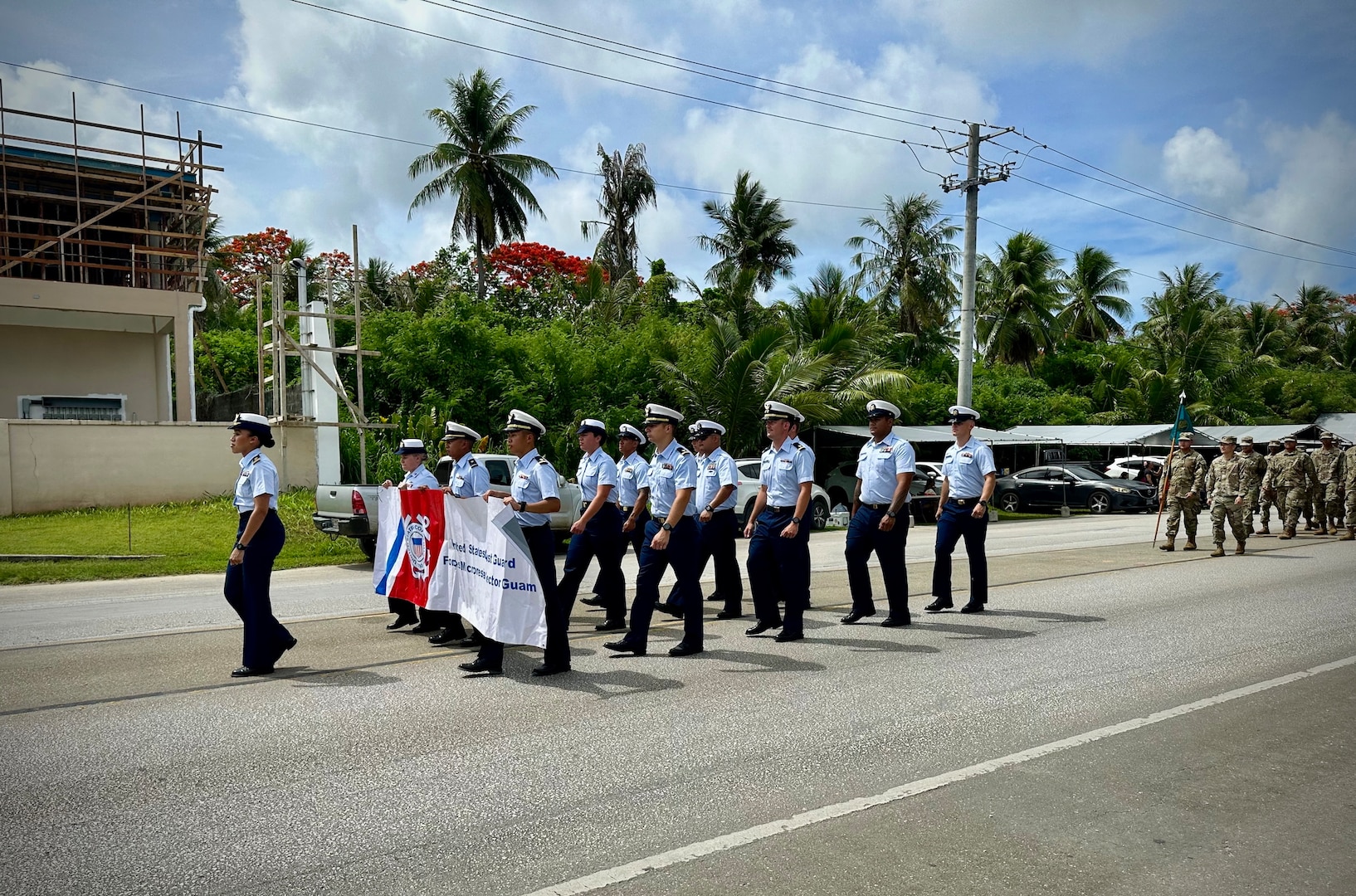 The Gonzaleses march alongside the USCGC Myrtle Hazard (WPC 1139) crew in the Saipan independence parade on July 4, 2023. The cutter was moored in Saipan, Commonwealth of the Northern Mariana Islands, for Independence Day while on an Operation Rematau patrol (U.S. Coast Guard photo)