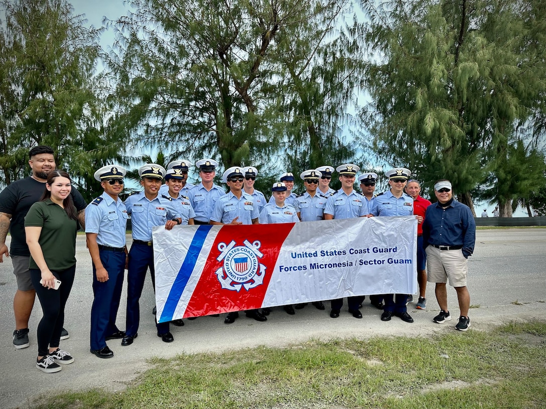 The Gonzaleses march alongside the USCGC Myrtle Hazard (WPC 1139) crew in their home of Saipan independence parade on July 4, 2023. The cutter was moored in Saipan, Commonwealth of the Northern Mariana Islands, for Independence Day while on an Operation Rematau patrol (U.S. Coast Guard photo)