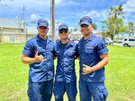 Cadets Genzo Gonzales, Seiji Gonzales, and Kyle San Nicolas of the U.S. Coast Guard Academy take a moment for a photo at a gathering following Typhoon Mawar in Guam on July 19, 2023. Bridging their love for the sea and cultural roots to the prestige of one of America's most renowned maritime institutions, the cadets spent their summer away in Guam. Cadet Noah Mesa also spent the summer in Guam but was underway on the USCGC Oliver Henry at the time of this photo. (U.S. Coast Guard photo by Chief Warrant Officer Sara Muir)