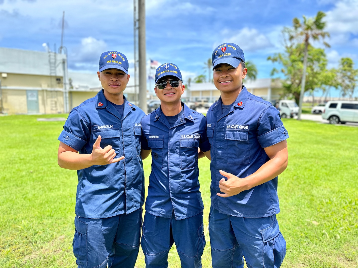 Cadets Genzo Gonzales, Seiji Gonzales, and Kyle San Nicolas of the U.S. Coast Guard Academy take a moment for a photo at a gathering following Typhoon Mawar in Guam on July 19, 2023. Bridging their love for the sea and cultural roots to the prestige of one of America's most renowned maritime institutions, the cadets spent their summer away in Guam. Cadet Noah Mesa also spent the summer in Guam but was underway on the USCGC Oliver Henry at the time of this photo. (U.S. Coast Guard photo by Chief Warrant Officer Sara Muir)
