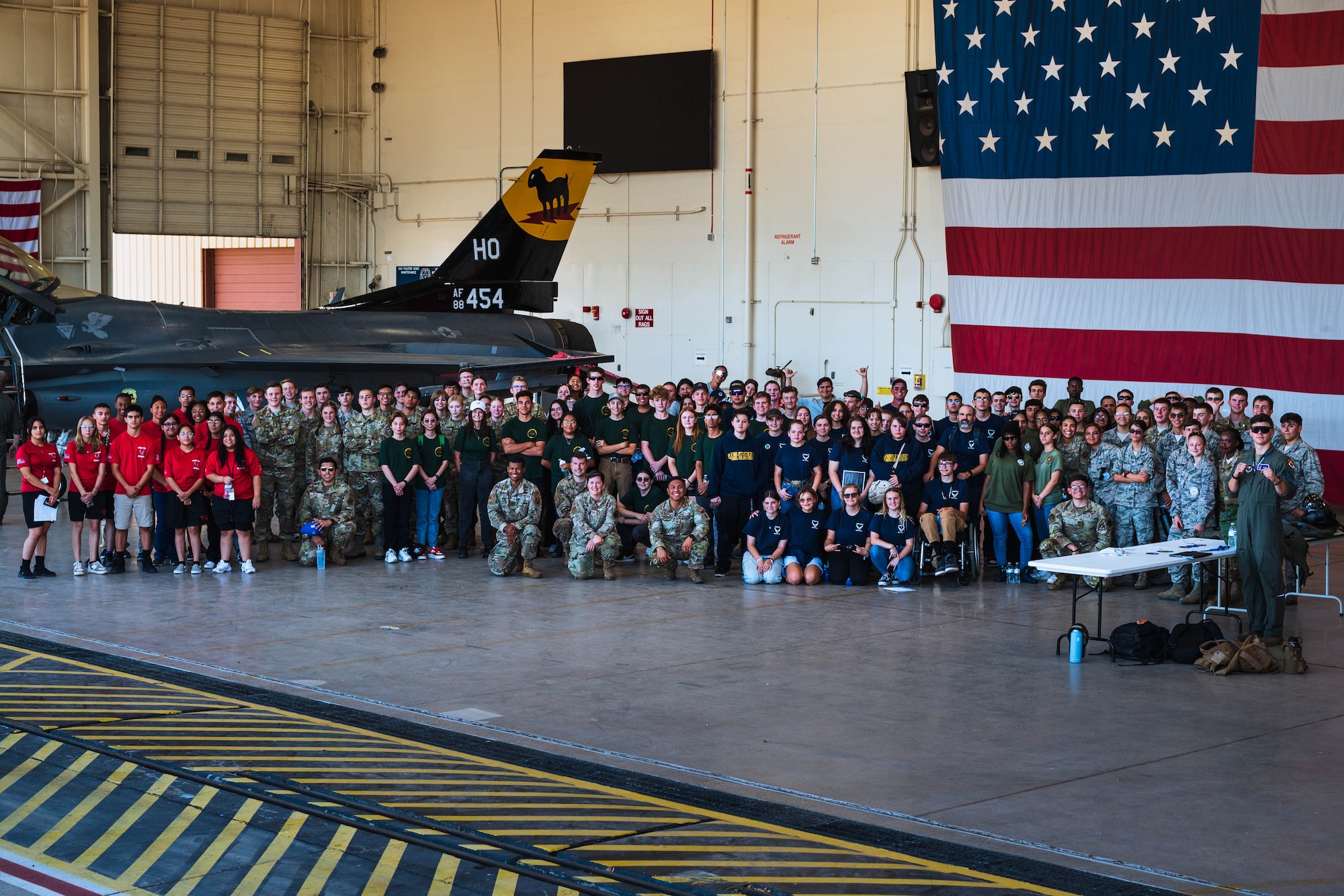 Junior ROTC cadets and instructors pose for a group photo with service members after the Luke Air Force Base JROTC Career Expo Sept. 29, 2023, at Luke AFB, Arizona.