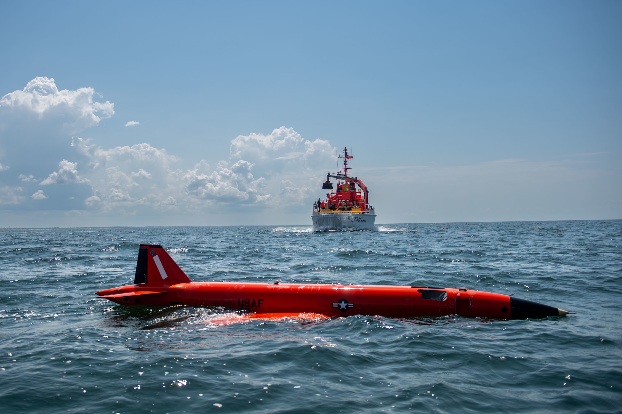 an aerial target floats in water while a boat approaches