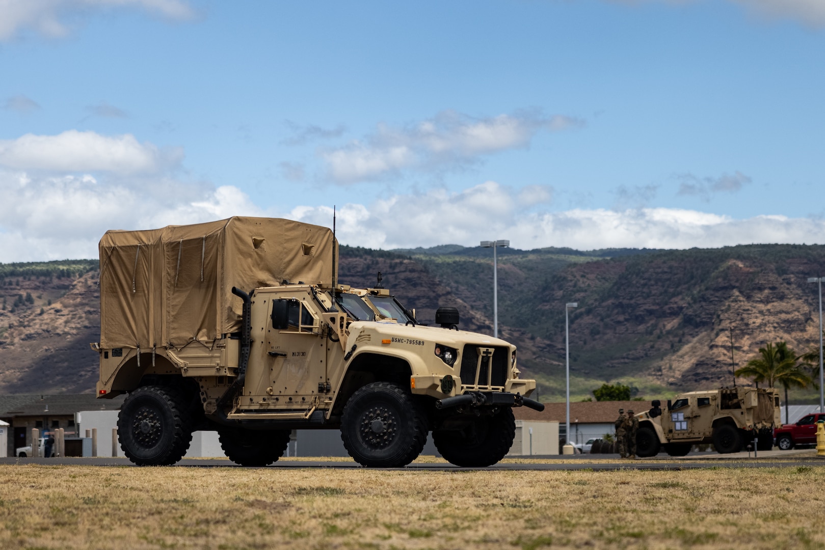 U.S. Marines with 3d Marine Littoral Regiment, 3d Marine Division, stage a High Mobility Multipurpose Wheeled Vehicle during Force Design Integration Exercise at Pacific Missile Range Facility, Barking Sands, Hawaii, Sept. 26, 2023. Force Design Integration Exercise demonstrates the current capabilities of 3d MLR as an effective part of the Stand-In Force integrated with our Pacific Marines and Joint counterparts. Through the demonstration of Force Design 2030-enabled capabilities, 3d MLR showcases the implementation of technology, doctrine, and policy initiatives to allow the SiF to sense and make-sense of potential adversaries, seize and hold key maritime terrain, and conduct reconnaissance and counter-reconnaissance.  (U.S. Marine Corps photo by Lance Cpl. Malia Sparks)
