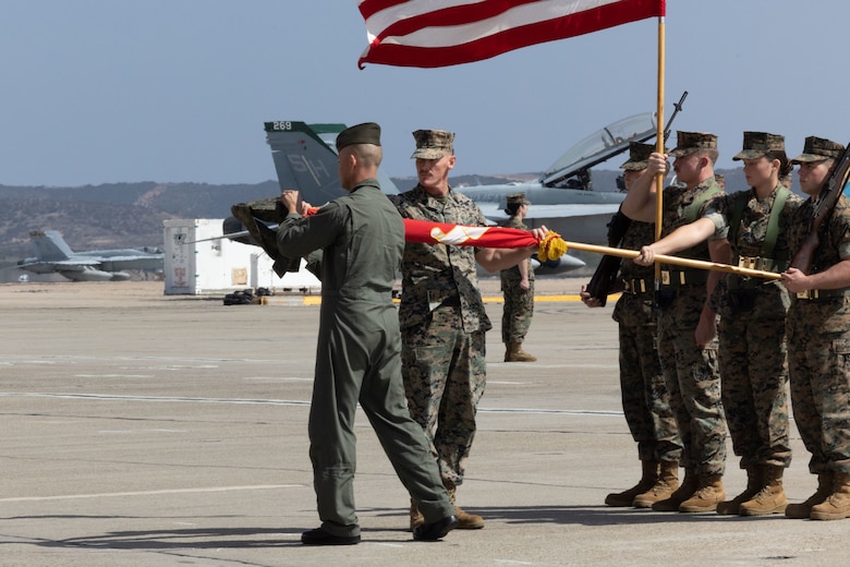U.S. Marine Corps Lt. Col. Ryan J. Franzen (left), commanding officer of Marine Fighter Attack Training Squadron (VMFAT) 101, Marine Aircraft Group 11, 3rd Marine Aircraft Wing, and Sgt. Maj. Jonas Johnson (center), sergeant major of VMFAT-101