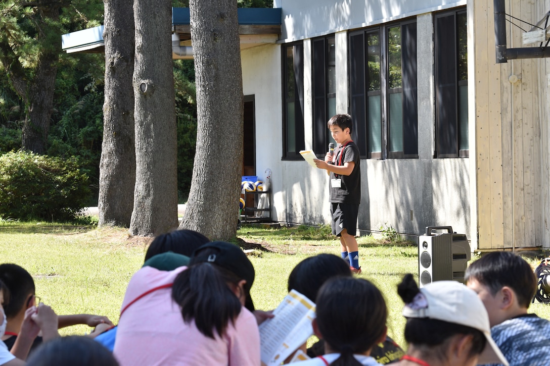 A child describes his English Camp memories to a listening audience, September 18, 2023. CATC Camp Fuji Marines mentored Japanese children through English Camp emersion course hosted by the National Chuo Youth Friendship Center in Gotemba, Japan.  (U.S. Marine Corps photo by Song Jordan)