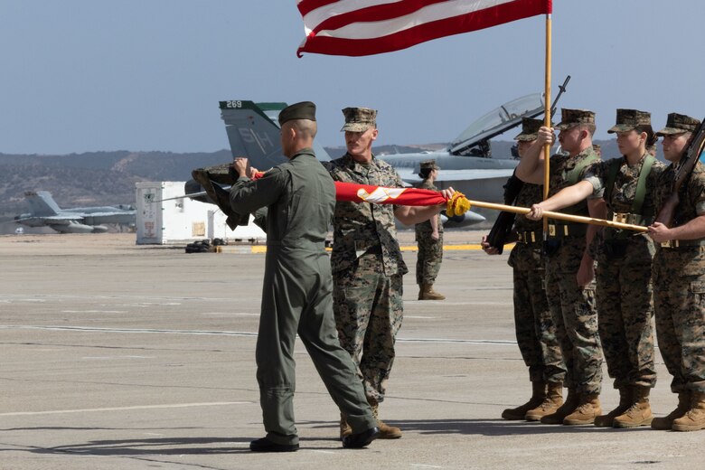 U.S. Marine Corps Lt. Col. Ryan J. Franzen (left), commanding officer of Marine Fighter Attack Training Squadron (VMFAT) 101, Marine Aircraft Group 11, 3rd Marine Aircraft Wing, and Sgt. Maj. Jonas Johnson (center), sergeant major of VMFAT-101
