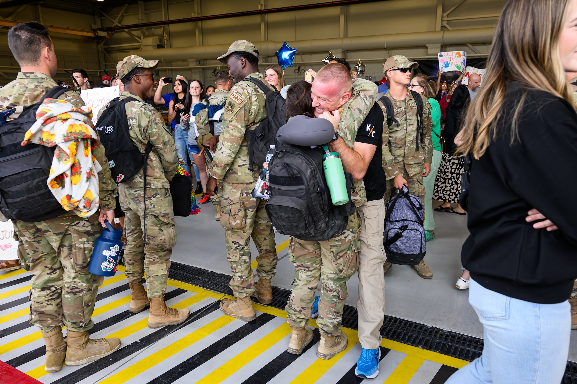 A photo of Airmen and family embracing