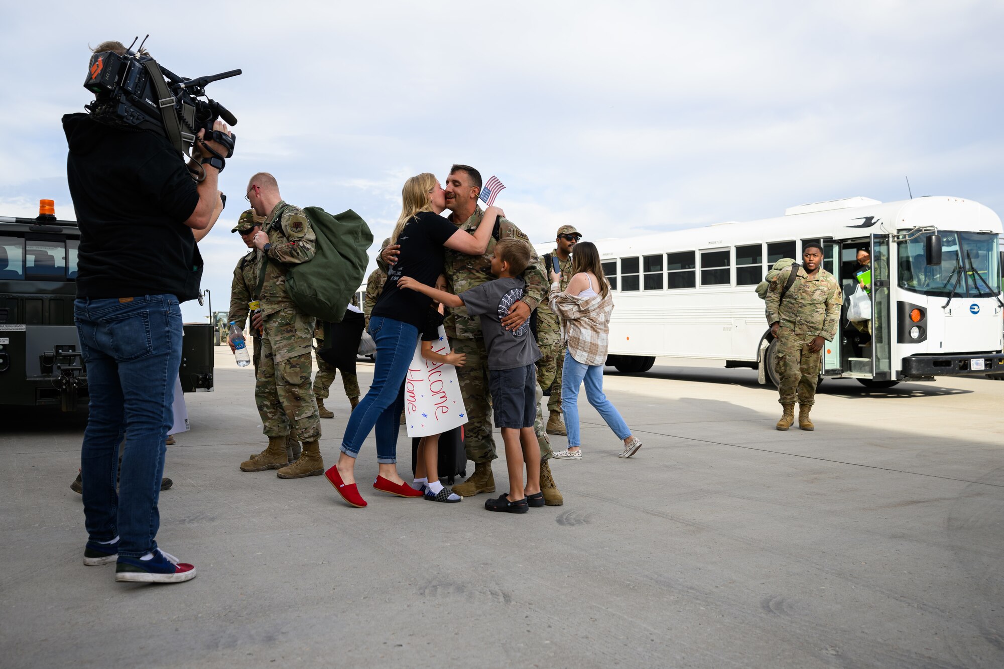 A photo of Airmen and family embracing