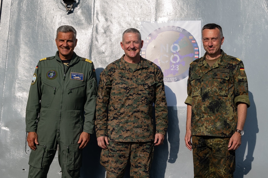 (From left to right) Vice Adm. Frank Lenski, Commander of the German Fleet and Supporting Forces and Vice Chief of the German Navy, Maj. Gen. Robert Sofge Jr., Commander of U.S. Marine Corps Forces, Europe and Africa, and Rear Adm. Stephan Haisch, Deputy Commander of the German Maritime Forces Staff, pose for a group picture aboard the USS Mesa Verde (LPD 19) during a distinguished visitor and media day for Northern Coast 2023 (NoCo 23), Sept. 18, 2023. NoCo 23 is a German-led multinational exercise that strengthens military and maritime combat readiness through realistic training in order to sharpen interoperability with our Allies and partners. The San Antonio-class amphibious transport dock ship USS Mesa Verde (LPD 19), assigned to the Bataan Amphibious Ready Group and embarked 26th Marine Expeditionary Unit (Special Operations Capable), under the command and control of Task Force 61/2, is on a scheduled deployment in the U.S. Naval Forces Europe area of operations, employed by U.S. Sixth Fleet to defend U.S., Allies, and partner interests. (U.S. Marine Corps photo by Cpl. Michele Clarke)