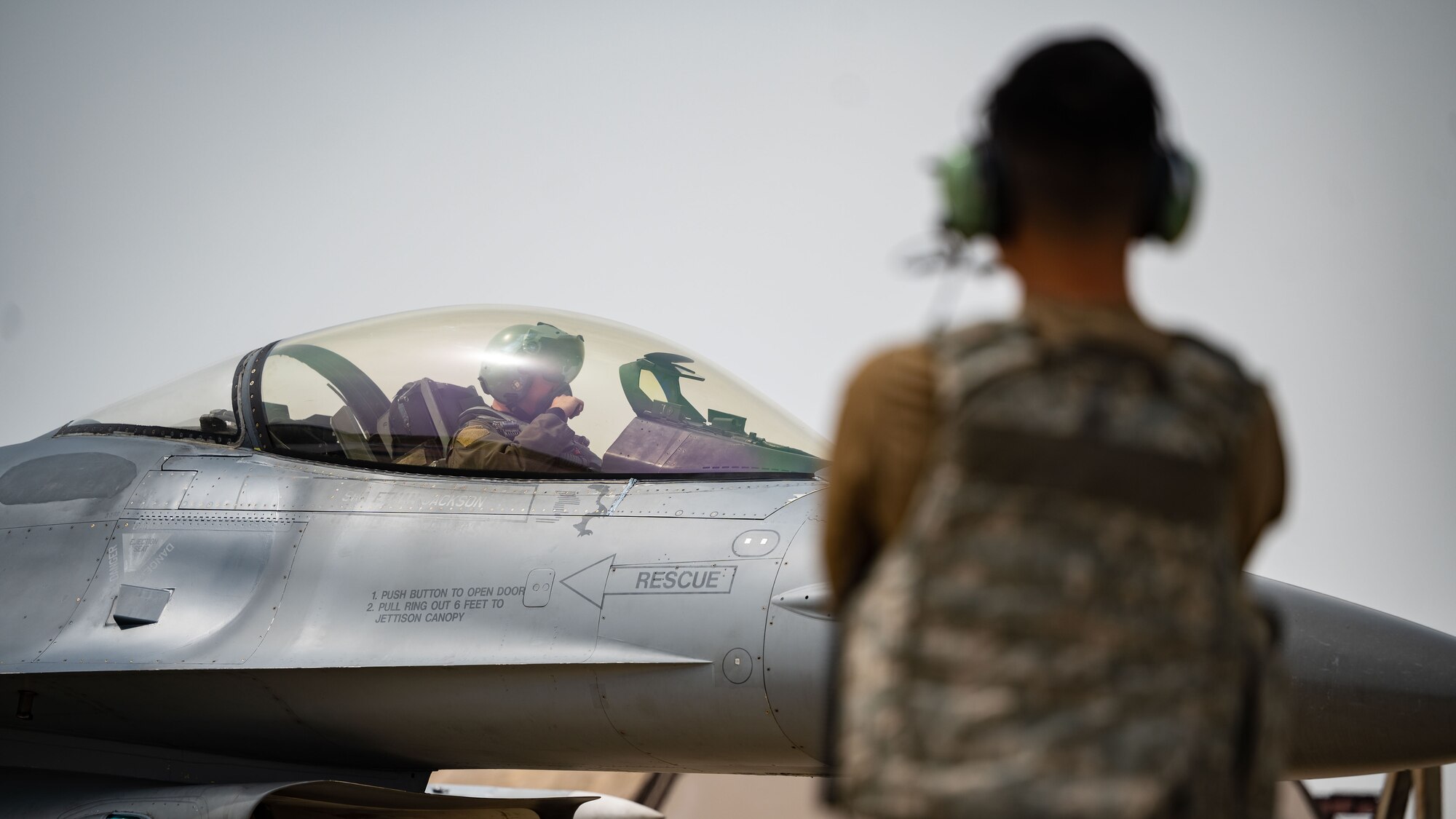 Airman 1st Class Gia-Bao Do finalizes preflight procedures to launch an F-16 Fighting Falcon.