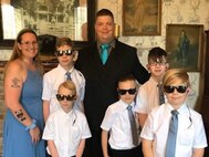 Staff Sgt Adam Proctor with his wife and five sons.
