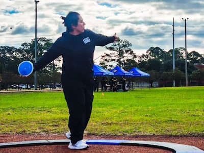 Spc. Bernice Carmona training in discus.