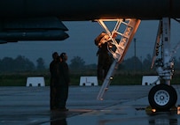 Members of the 9th Expeditionary Bomb Squadron help crew members exit a B-1B Lancer assigned to Dyess Air Force Base, Texas, during Bomber Task Force 24-2 at Morón Air Base, Spain, March 24, 2024. BTF 24-2 is a part of LSGE 24, an umbrella term that incorporates dozens of separate exercises and military activities, under multiple combatant commands, that enable the U.S. Joint Force to train with Allies and partners and improve shared understanding, trust and interoperability on security challenges across the globe. (U.S. Air Force photo by Staff Sgt. Holly Cook)