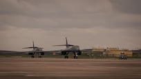 Two B-1B Lancers with the 9th Expeditionary Bomb Squadron from Dyess Air Force Base, Texas, taxi on the taxiway at Mor�n Air Base, Spain, in support of Bomber Task Force Europe, March 26, 2024. The U.S. is dedicated to security commitments to Allies and partner nations across the globe and routinely operate worldwide and maintain the agility to respond to any challenges in the operational environment. (U.S. Air Force photo by Senior Airman Zachary Wright)