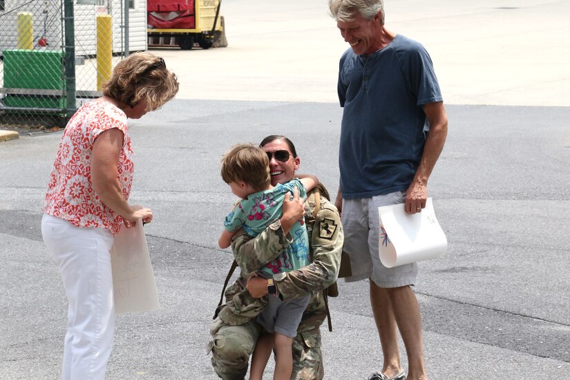Soldiers with the 1069th Military Police Company, 55th Maneuver Enhancement Brigade arrive home and reunite with loved ones July 1, 2022, after a year-long deployment to Cuba. The Soldiers were also greeted at Harrisburg International Aiport by Brig. Gen. Laura McHugh, Pennsylvania Deputy Adjutant General-Army, and other senior leaders with the Pennsylvania National Guard.