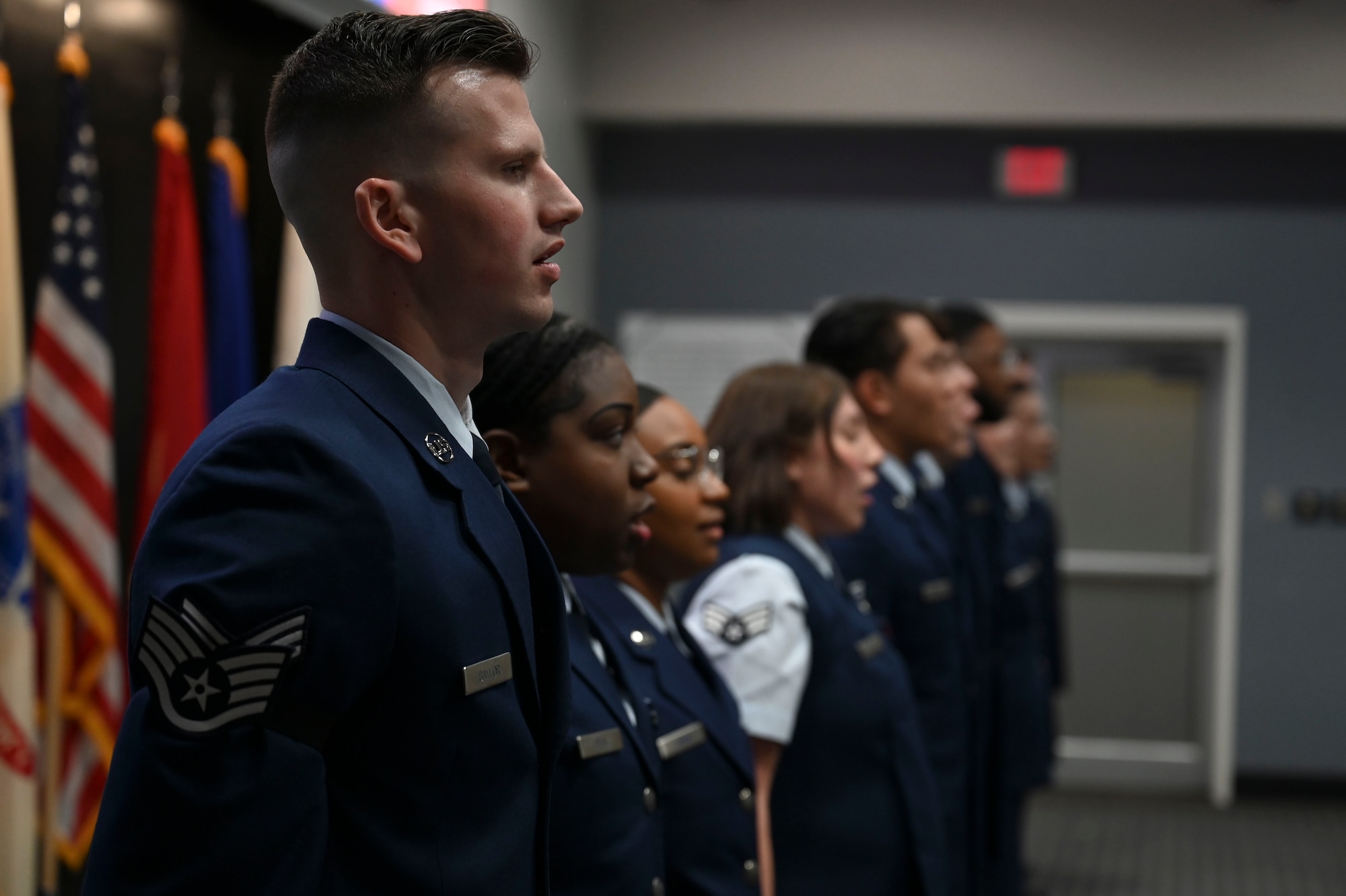 Airman Leadership School Class 24-C graduates sing “The U.S. Air Force” at the end of their graduation ceremony at the Powell Event Center, Goodfellow Air Force Base, Texas, March 29, 2024.  “The U.S. Air Force” is the official song of the United States Air Force. (U.S. Air Force photo by Airman 1st Class Madison Collier)