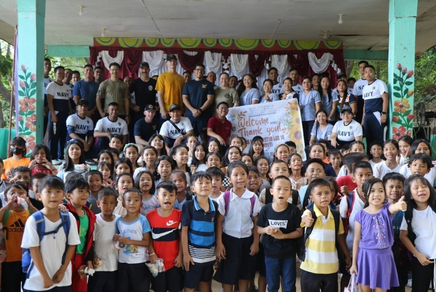 USS Manchester (LCS 14), Philippine Navy Sailors visit Agusuhin Elementary School in Subic Bay