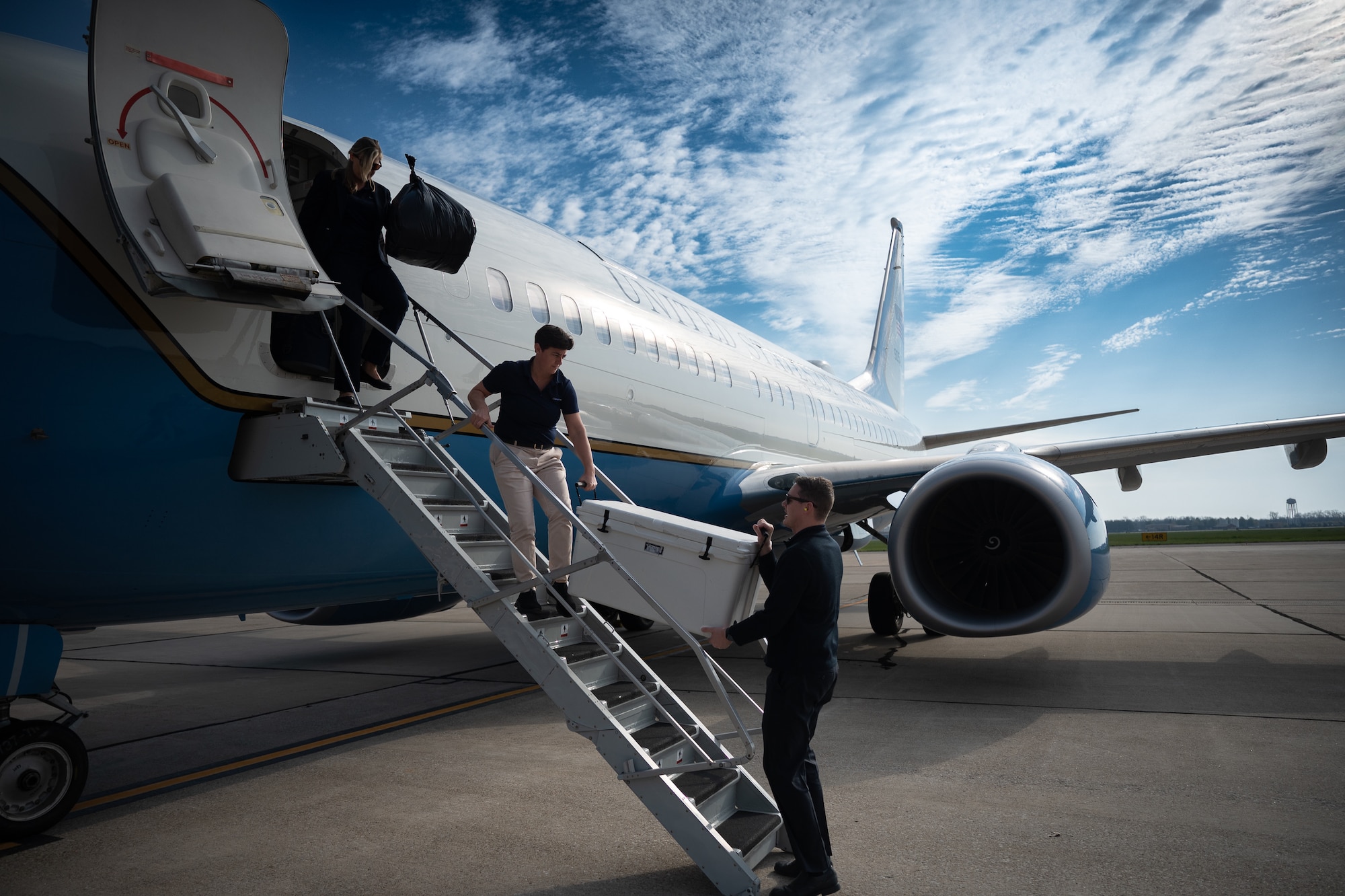 Flight attendants with the 73rd Airlift Squadron unload a 932nd Airlift Wing C-40C aircraft post-mission return on March 31, 2024, Scott Air Force Base, Illinois. (U.S. Air Force photo by Christopher Parr)(U.S. Air Force photo by Christopher Parr)