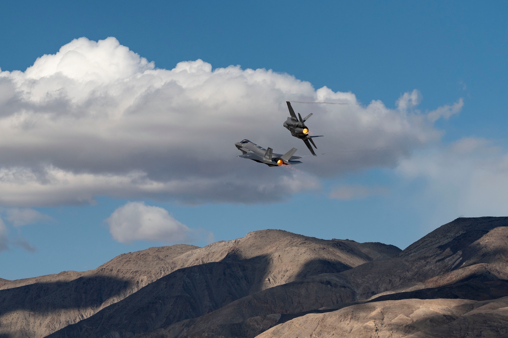 Two Royal Netherlands Air Force F-35A Lightning IIs conduct a familiarization flight over a low-level training area for Red Flag-Nellis 24-2, March 7, 2024.