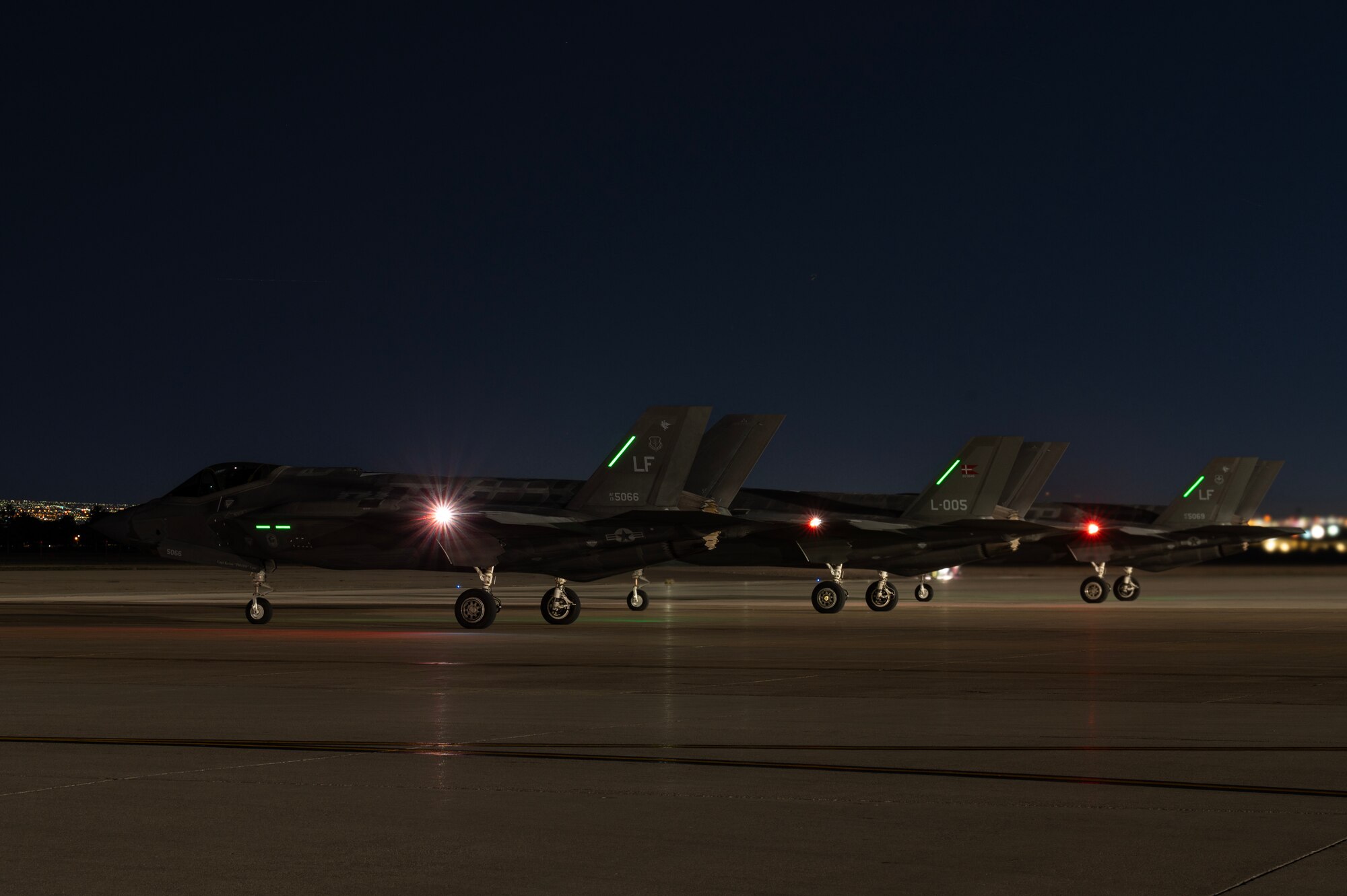 Three F-35A Lightning IIs assigned to Luke Air Force Base (AFB), Arizona, wait to take off for Red Flag-Nellis 24-2 mission at Nellis AFB, Nevada, March 20, 2024.