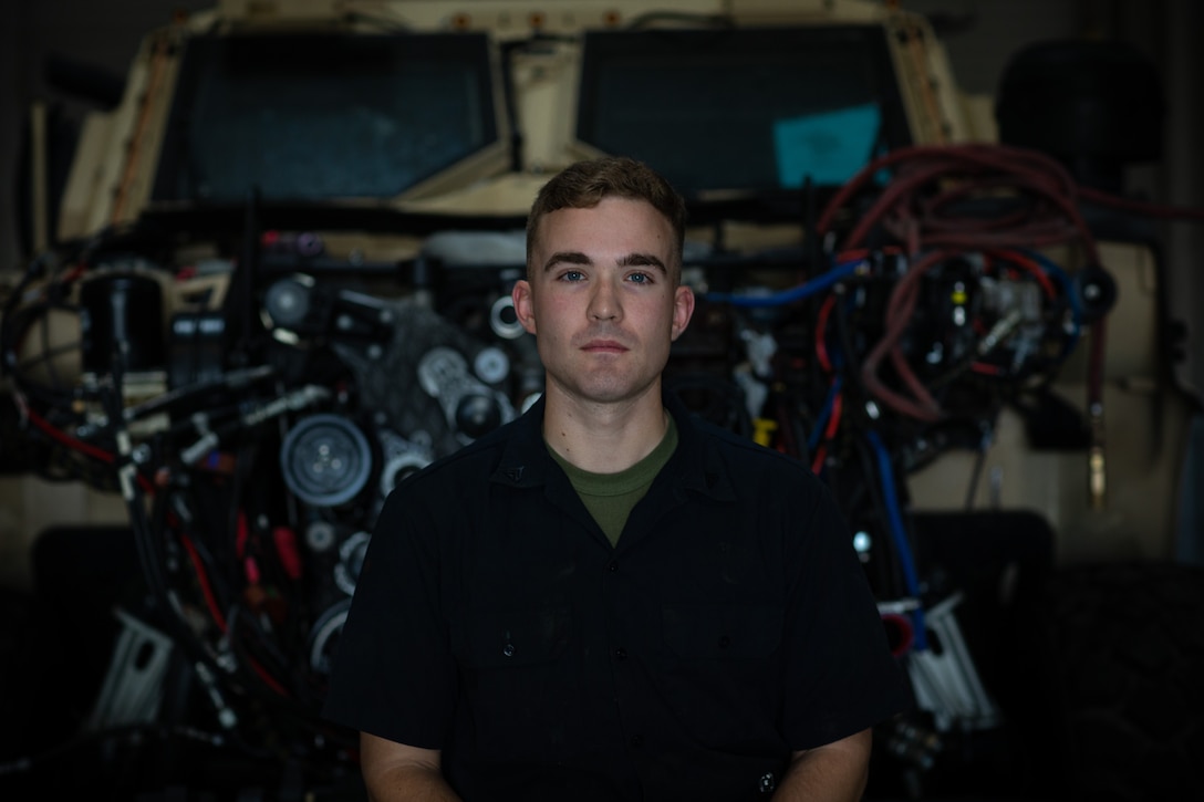 U.S. Marine Corps Cpl. Michael N. Hawley, an automotive maintenance technician with 9th Communcation Battalion, I Marine Expeditionary Force Information Group, I Marine Expeditionary Force, poses for a portrait as the 2023 Motor Transport Maintenance Technician of the Year, March 12, 2024. Motor transport Marines are responsible for the operation, maintenance, and transportation of vehicles and equipment in support of combat and garrison operations. (U.S. Marine Corps photo by Sgt. Marcus E. Melara)