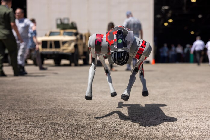 A quadruped robot demonstrates basic movements during the U.S. Indo-Pacific Command Pacific Operational Science and Technology Conference held at Marine Corps Base Hawaii, March 7, 2024. The conference brought Indo-Pacific area experts in science, technology, and security together to understand and successfully address operational issues and challenges across the region. (U.S. Marine Corps photo by Lance Cpl. Dezmond Browning)