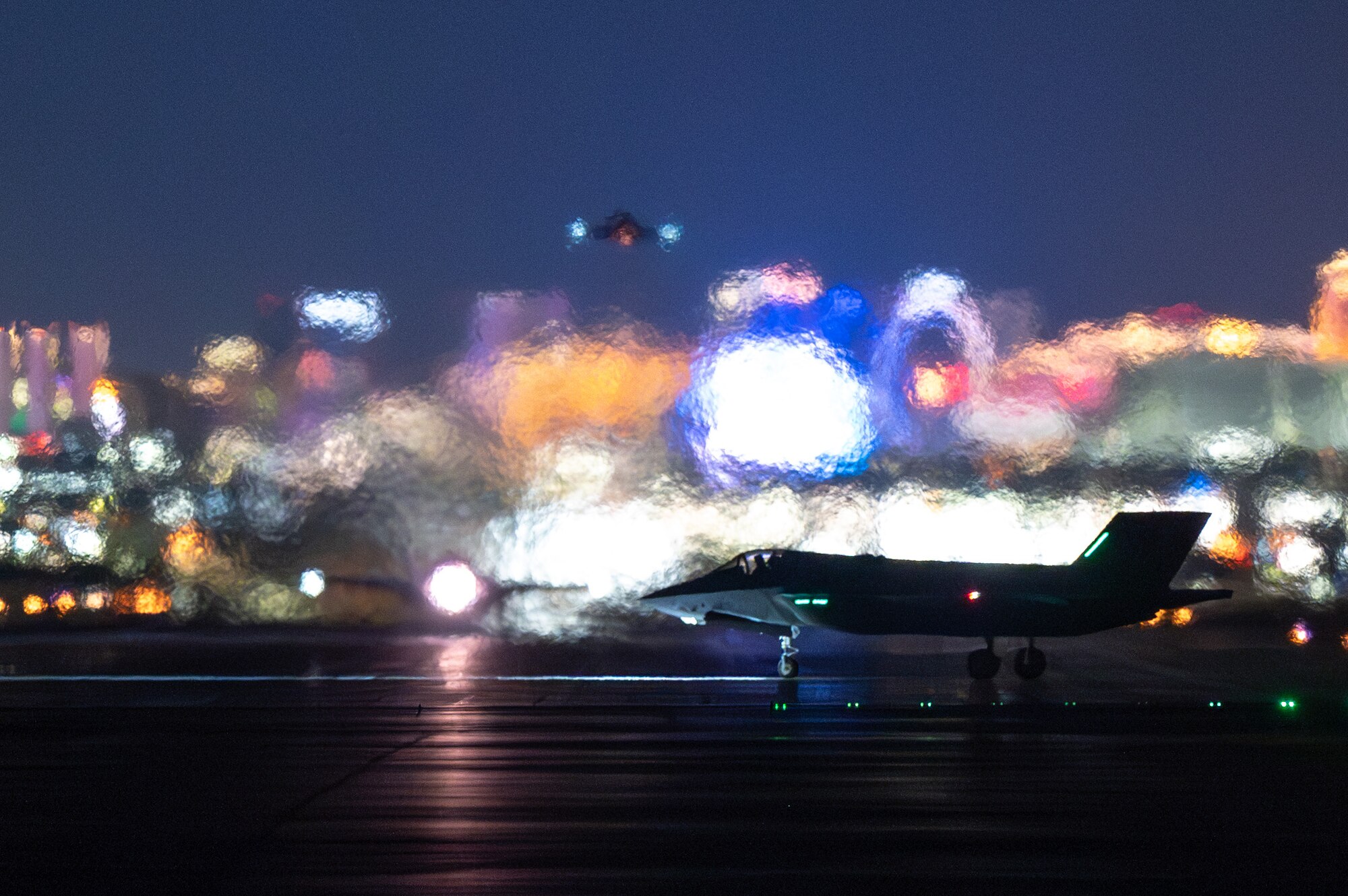 Three F-35 Lighting IIs take off for a night mission during Red Flag-Nellis 24-2 at Nellis Air Force Base, Nevada, March 21, 2024.