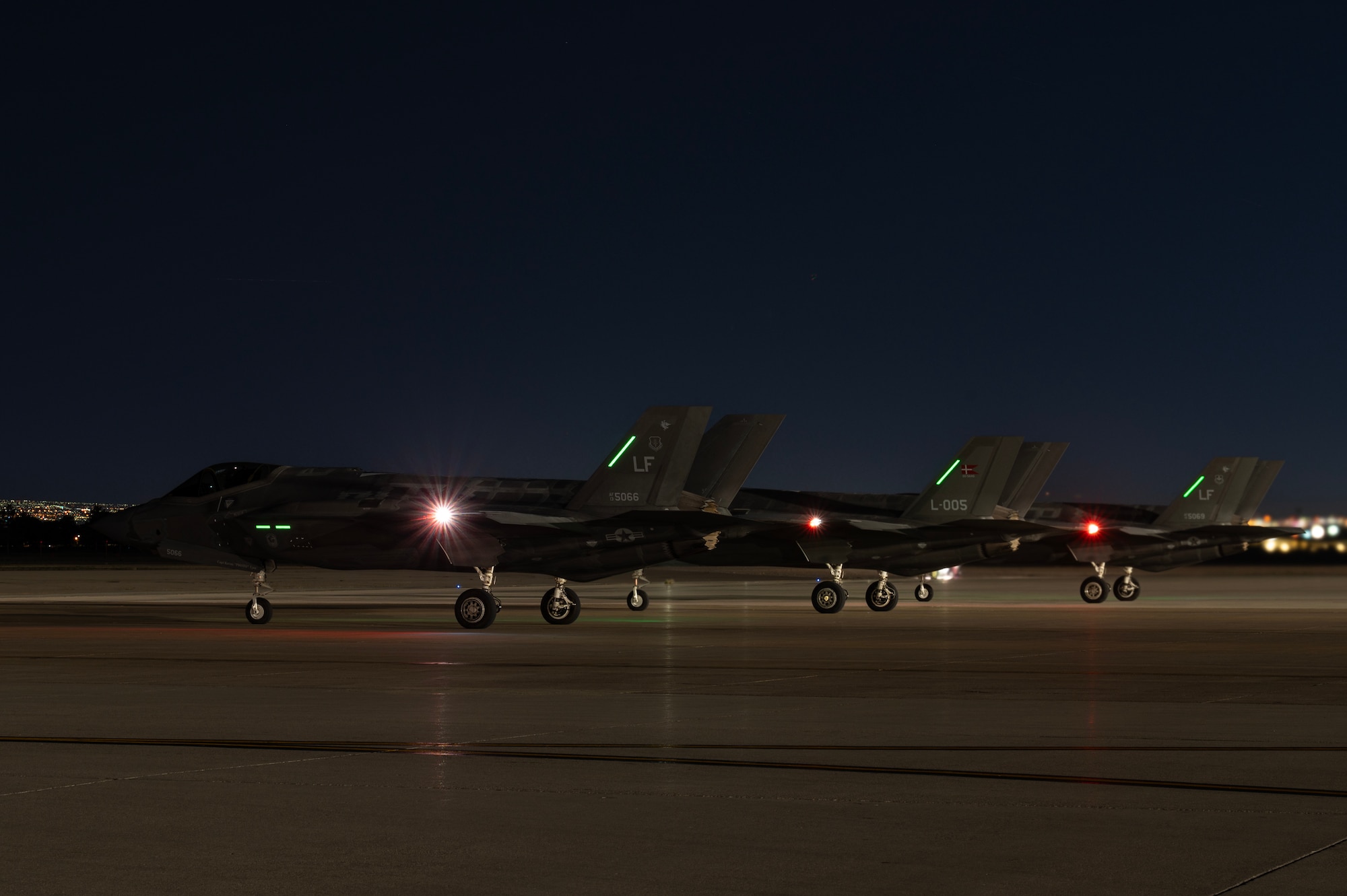 Three F-35A Lightning IIs assigned to Luke Air Force Base (AFB), Arizona, wait to take off for Red Flag-Nellis 24-2 mission at Nellis AFB, Nevada, March 20, 2024.