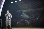 Staff Sgt. Justin Aaron, 80th Fighter Generation Squadron dedicated crew chief, provides armed guard surveillance during an F-16 Fighting Falcon launch during Beverly Sentinel 24-1 at Kunsan Air Base, Republic of Korea, March 27, 2024. Airmen from the 35th and 80th FGS exercised general arming procedures to provide security over vital infrastructure and equipment while preparing F-16s for routine flying operations. (U.S. Air Force photo by Senior Airman Karla Parra)