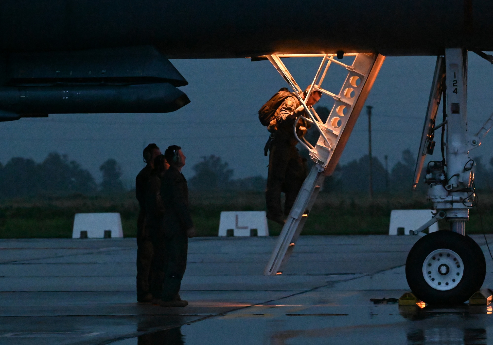 Members of the 9th Expeditionary Bomb Squadron help crew members exit a B-1B Lancer assigned to Dyess Air Force Base, Texas, during Bomber Task Force 24-2 at Morón Air Base, Spain, March 24, 2024. BTF 24-2 is a part of LSGE 24, an umbrella term that incorporates dozens of separate exercises and military activities, under multiple combatant commands, that enable the U.S. Joint Force to train with Allies and partners and improve shared understanding, trust and interoperability on security challenges across the globe. (U.S. Air Force photo by Staff Sgt. Holly Cook)