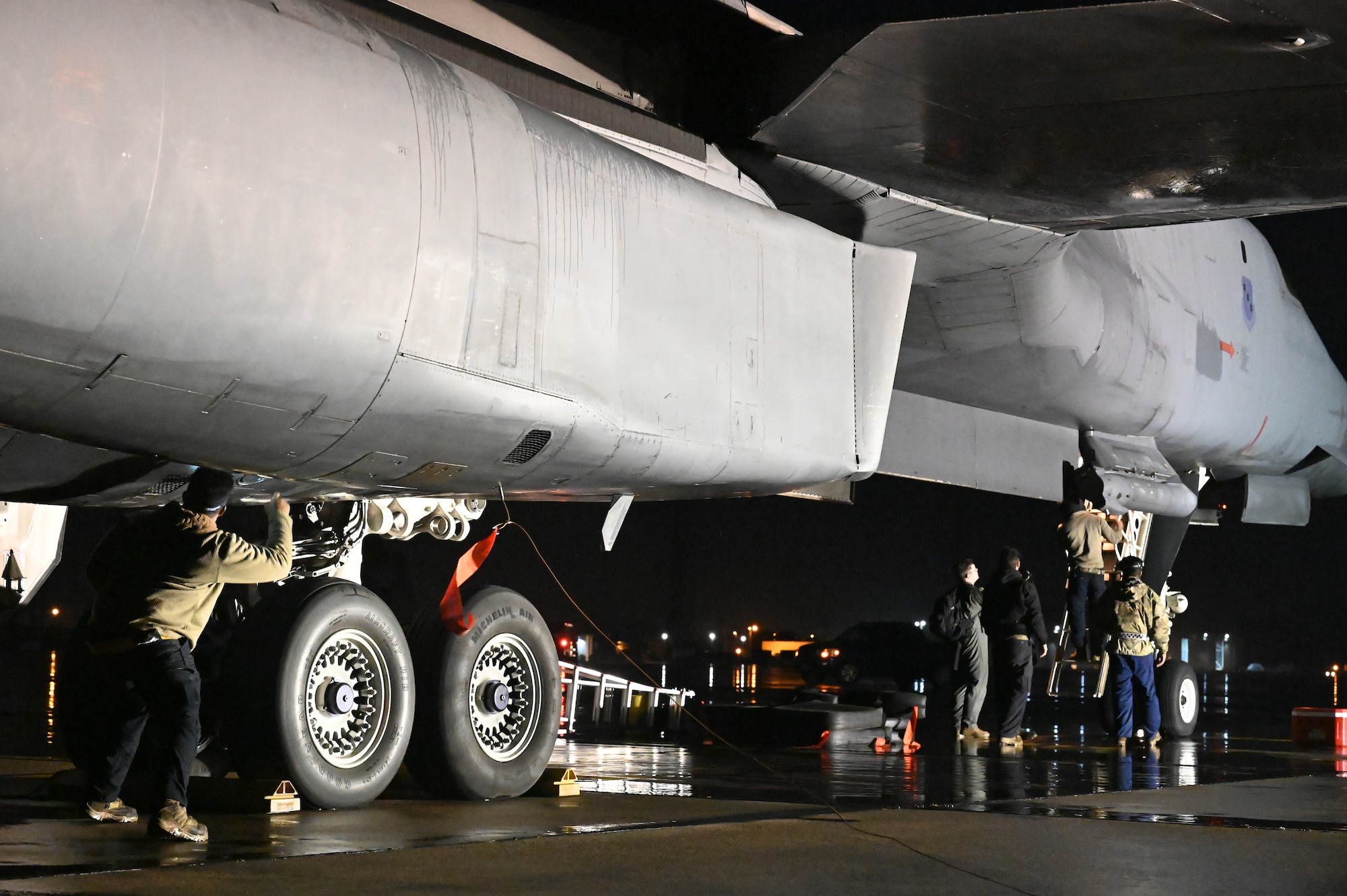 Members of the 9th Expeditionary Bomb Squadron perform post-flight maintenance and help crew members exit a B-1B Lancer assigned to Dyess Air Force Base, Texas, during Bomber Task Force 24-2 at Morón Air Base, Spain, March 24, 2024. Agile logistics and mobility activities, as showcased in operations and exercises, directly strengthen the U.S.’ ability to support Allies and partners and respond to potential crises. (U.S. Air Force photo by Staff Sgt. Holly Cook)