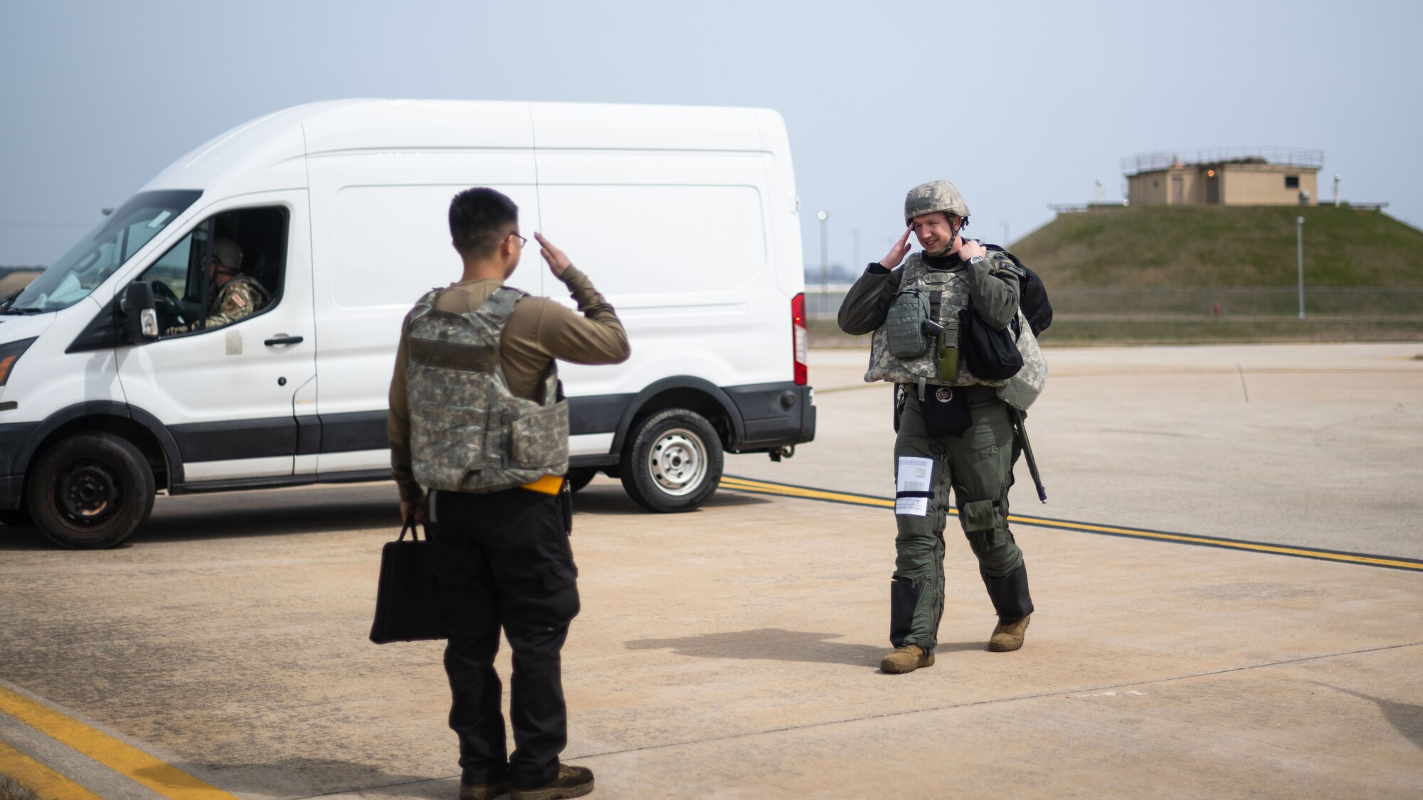Airman 1st Class Gia-Bao Do salutes Lt. Col. Brandon July before a training sortie as part of Beverly Sentinel 24-1.