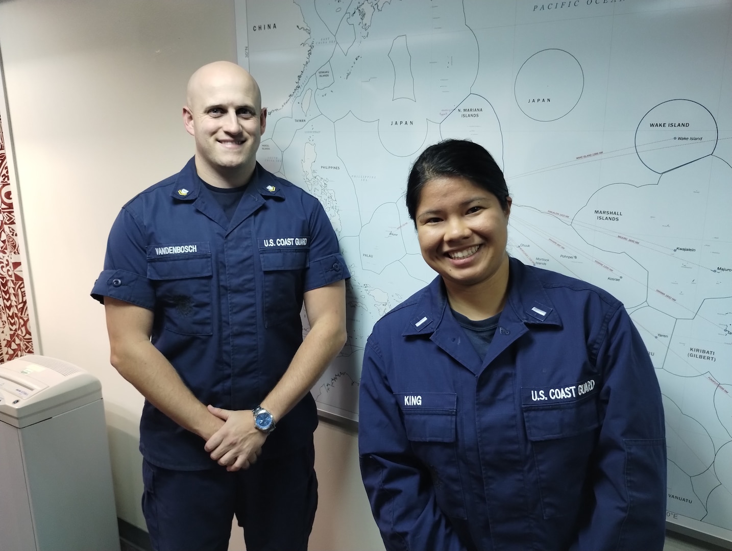 Lt. j.g. Deborah King and Petty Officer 2nd Class Paul Vandenbosch stand for a photo following the successful completion of a Joint Rescue Sub-Center a SAR communication exercise with the Maritime Rescue and Coordination Center (MRCC) in Japan on Jan. 31, 2024, simulating scenarios involving distressed vessels. The exercise, spanning an hour, enabled both parties to assess their strengths and identify areas for improvement. These exercises fortified international SAR collaboration and enhanced JRSC Guam's preparedness to facilitate effective rescue operations across its 1.9 million square mile jurisdiction—the largest SAR responsibility zone of any U.S. Coast Guard sector. (U.S. Coast Guard photo)